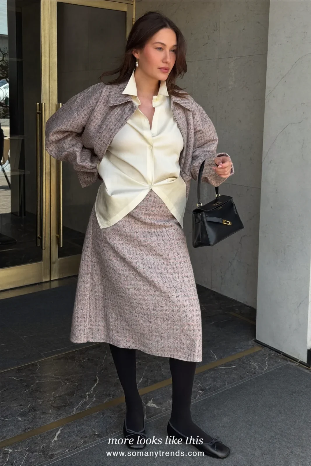 Woman in dusty pink and gray tweed boxy jacket and matching midi skirt, cream shirt, black tights and black flats, look 19