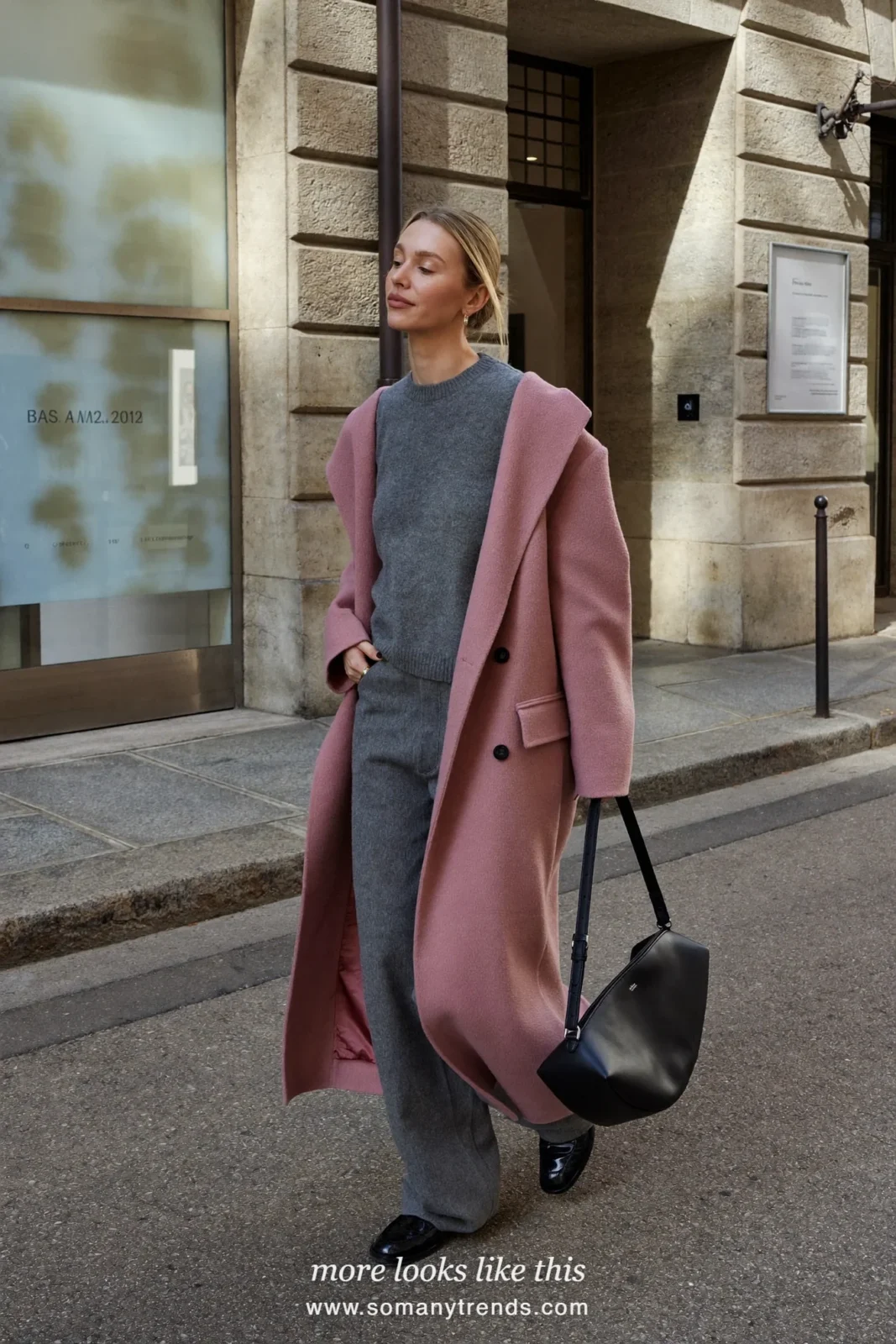 Woman in dusty pink long wool coat, gray knit sweater, gray pants and black loafers, look 30