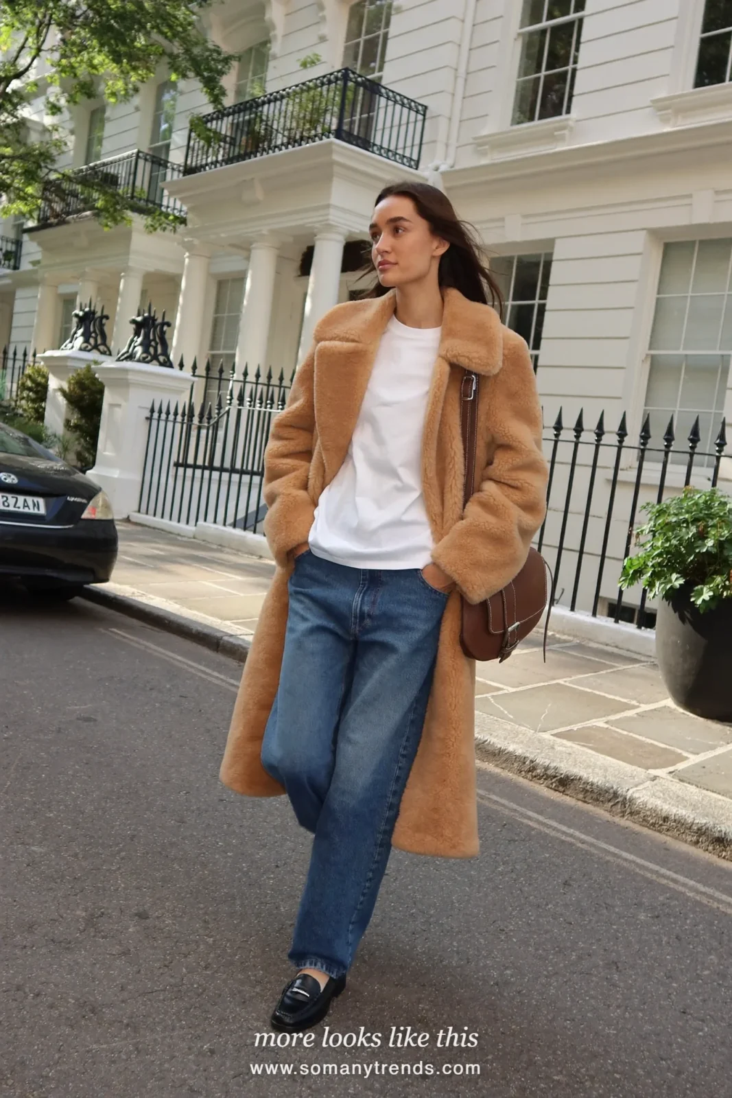 Long camel teddy coat over white tee, straight blue jeans and black loafers, outfit 1
