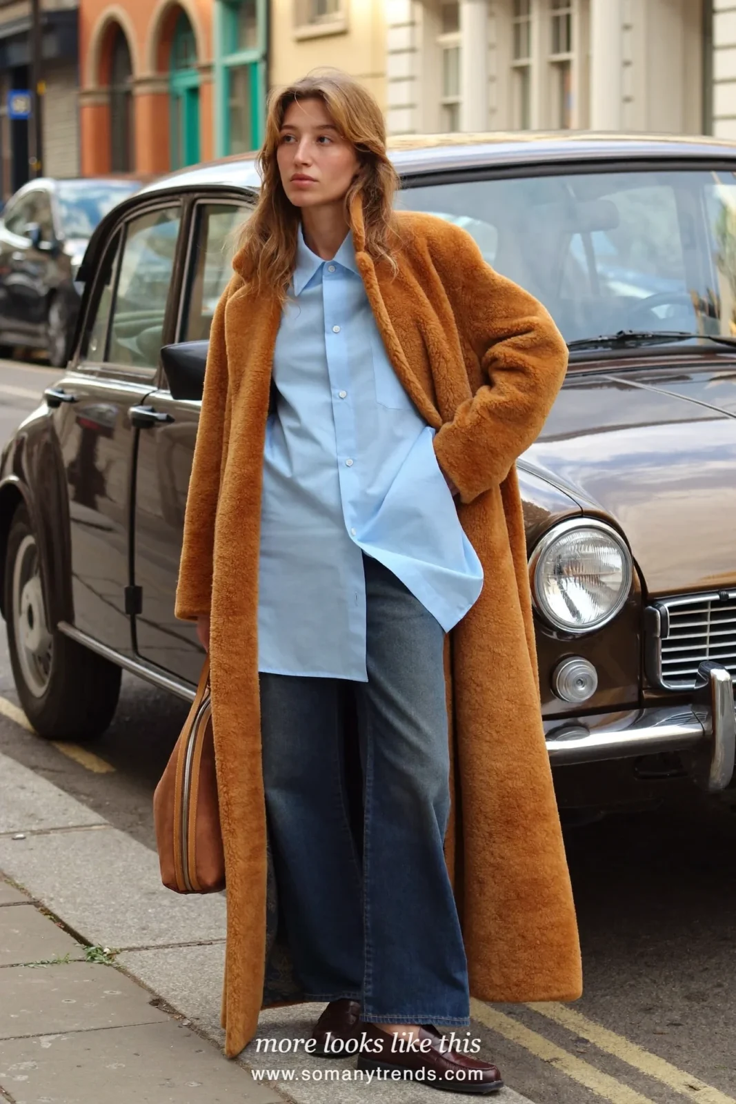 Camel teddy coat over baby blue poplin shirt, dark straight jeans and brown loafers, outfit 14
