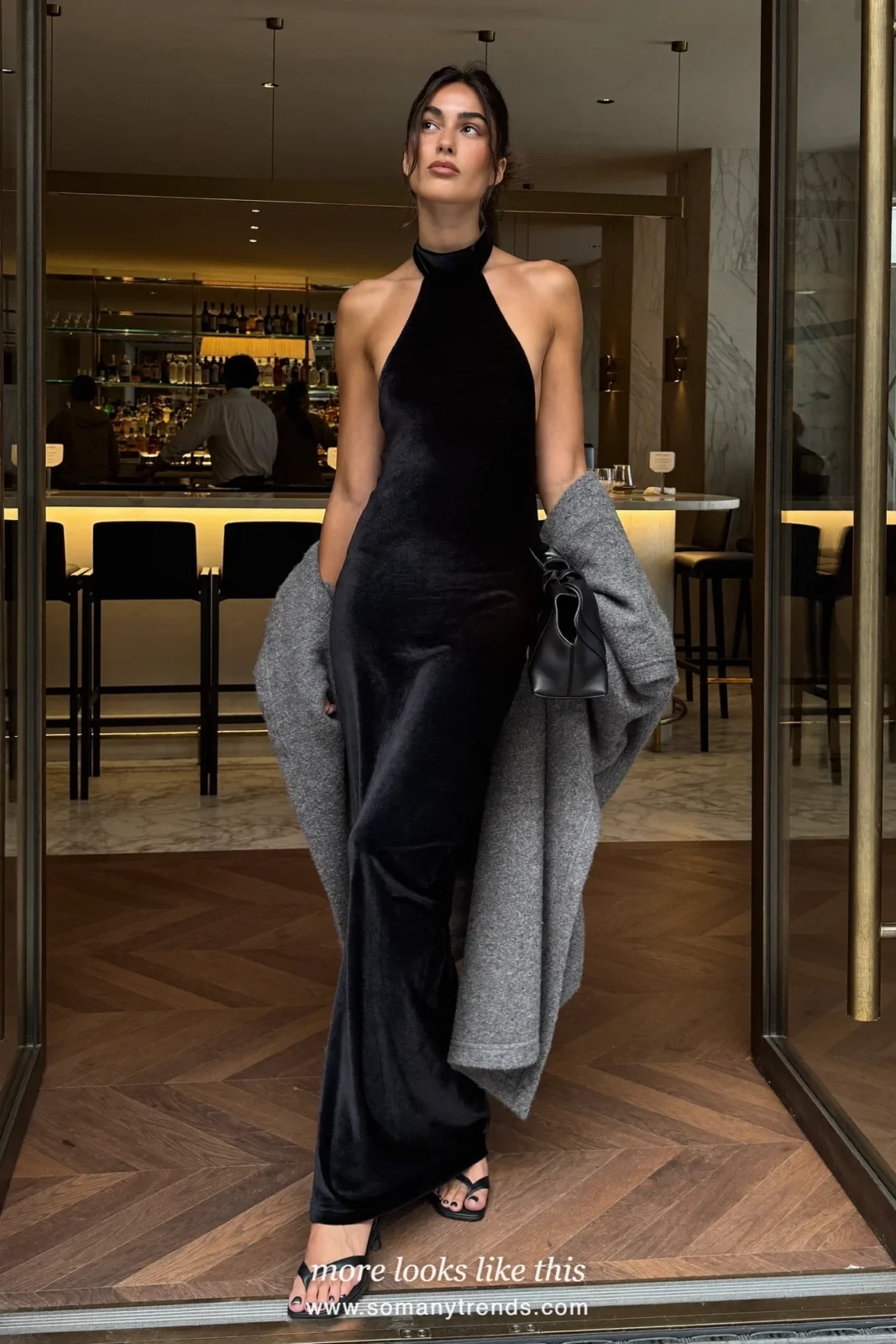 Woman in black halter maxi dress with soft gray wool wrap and black heels, outfit 11