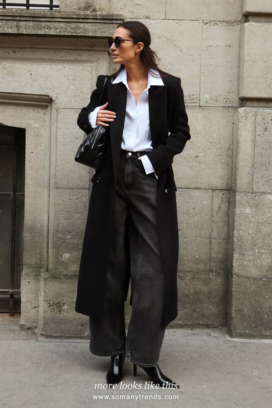 Woman in a black tailored coat, white shirt, black wide-leg jeans and black boots, outfit 22