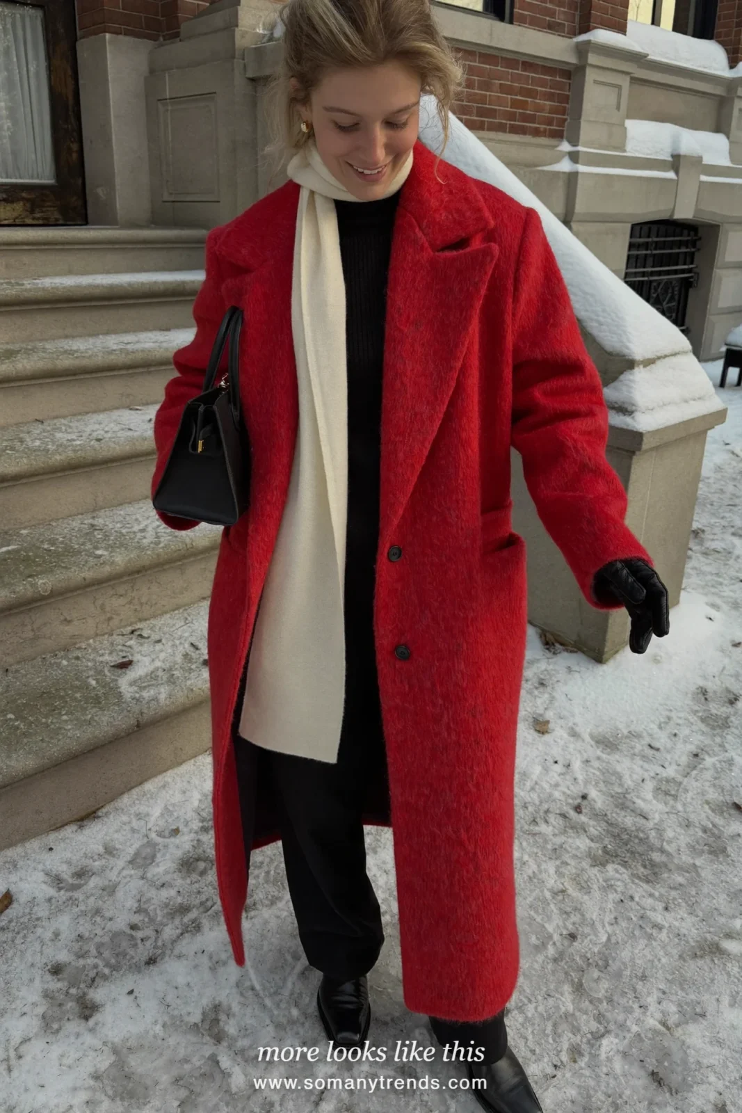 Long red wool coat with black pants, ivory scarf and black boots on a snowy street, outfit 25