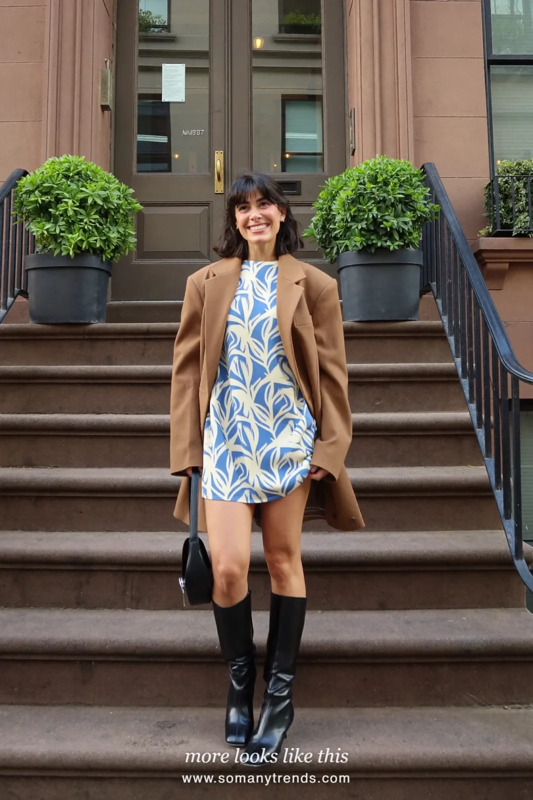 Woman in a tan oversized blazer, printed mini dress and black knee-high boots, house party outfit 5