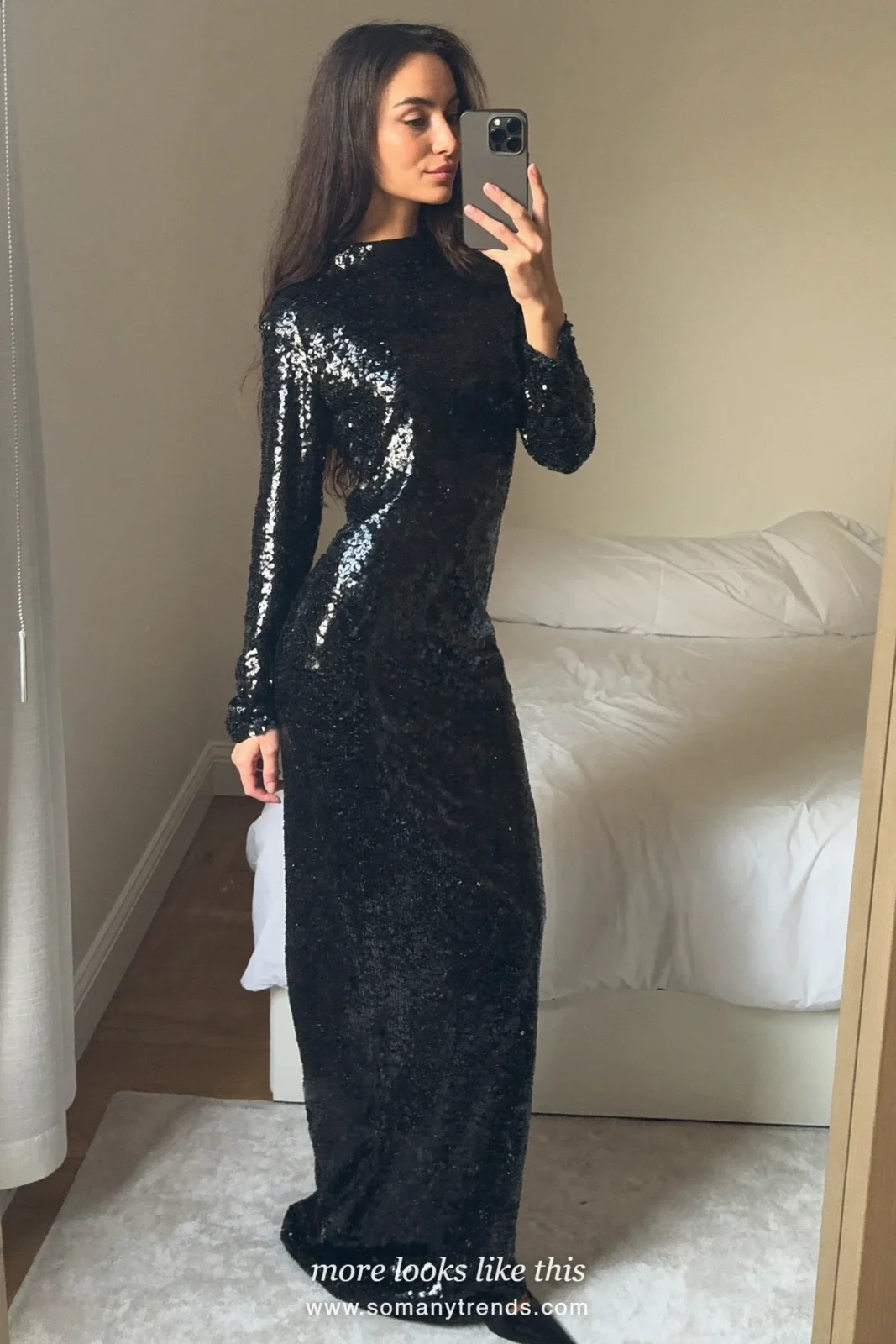 Woman in a black sequin long-sleeve maxi gown at a candlelit bar, outfit 8