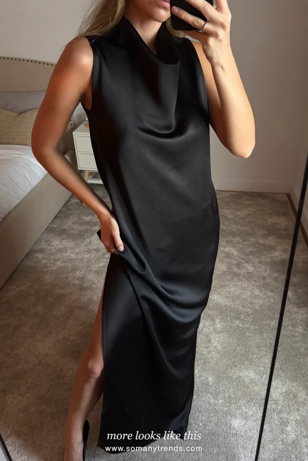 Woman in a black satin cowl-back gown by a gilded mirror, mirror selfie, outfit 24