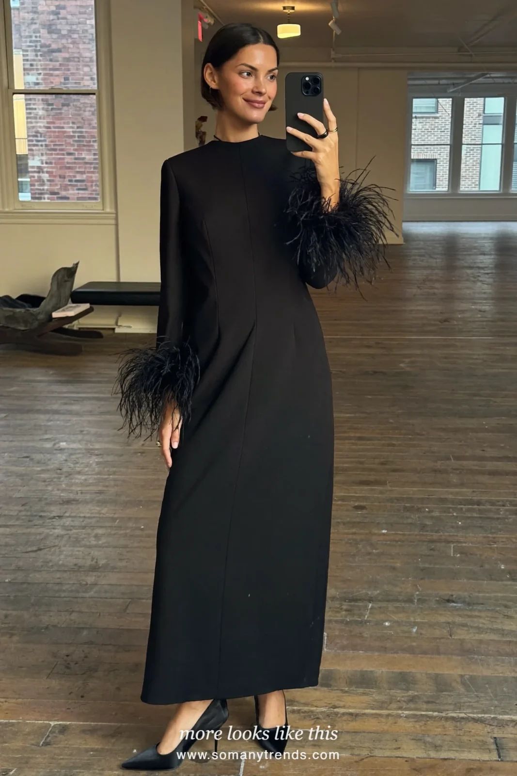 Woman in a black column gown with feather-trimmed sleeves, mirror selfie, outfit 28