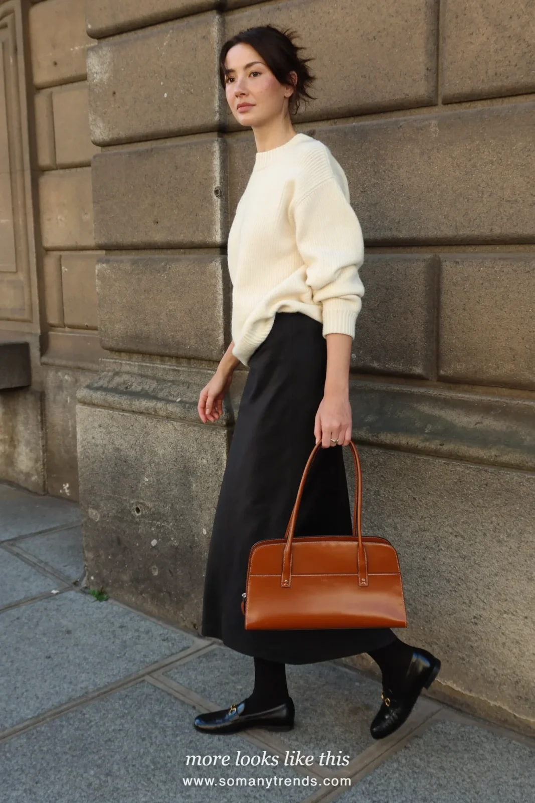 Look 9: long black column skirt, ivory ribbed sweater, sheer black tights and black loafers