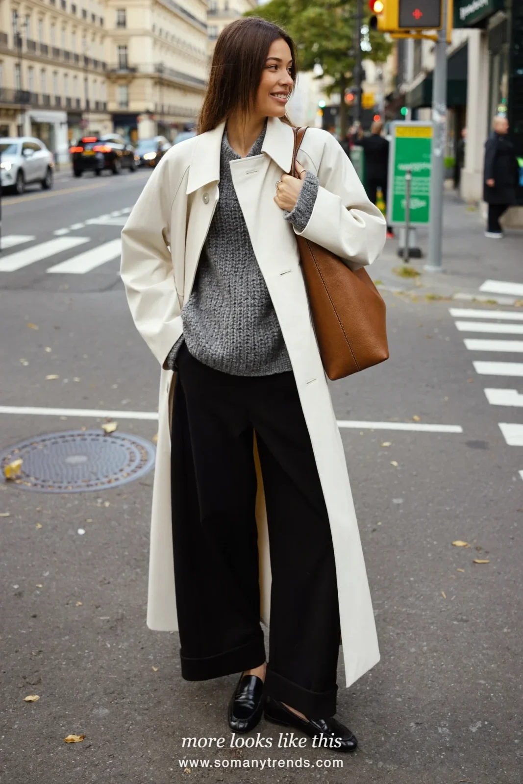 Look 22: ivory trench coat, gray knit, wide black pants and black loafers