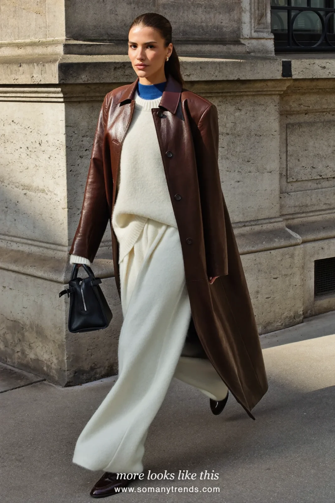Look 23: chocolate leather coat, cream sweater, cream pants and brown loafers