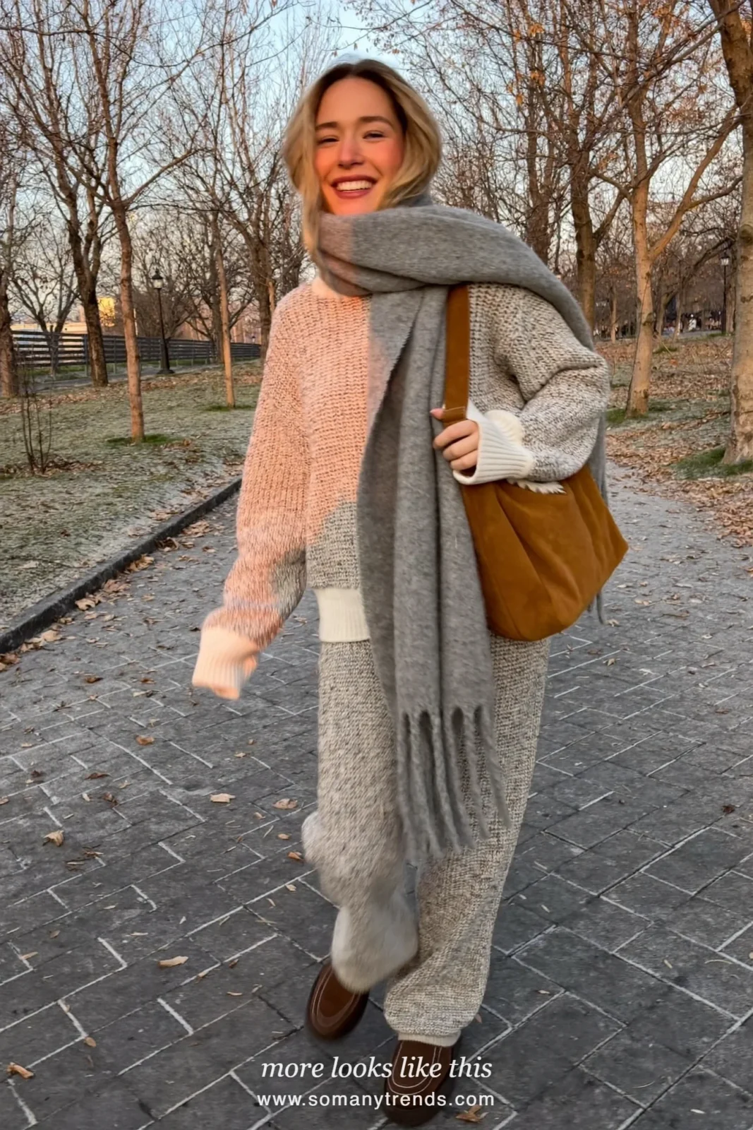 Look 25: ivory knit sweater and pants set, gray scarf and shearling loafers