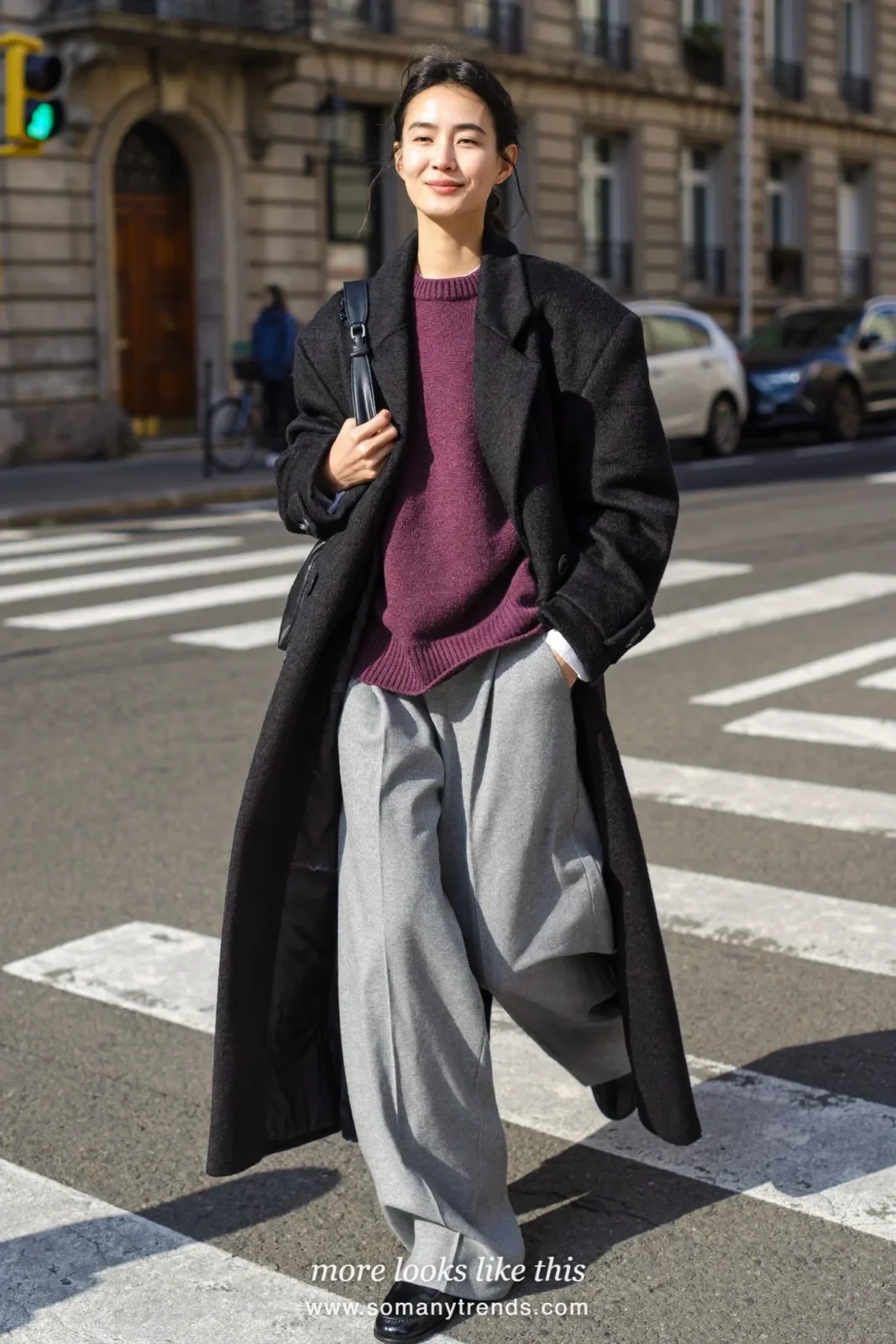 Look 29: black long coat, plum knit, wide gray pants and black loafers