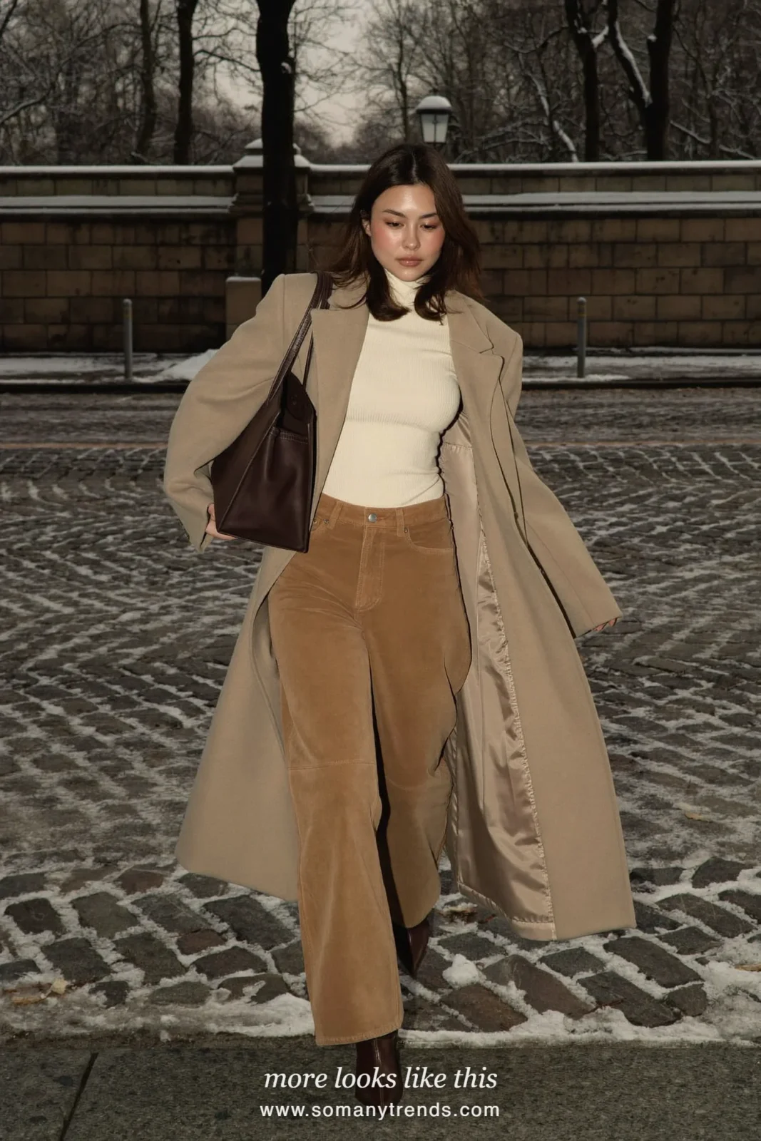 Woman in camel suede wide-leg pants, long wool coat, cream ribbed knit and pointed boots, outfit 6