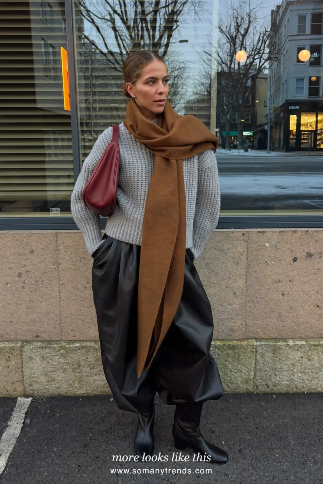 Woman in black leather wide-leg pants, gray sweater, brown scarf, burgundy bag and black boots, outfit 7