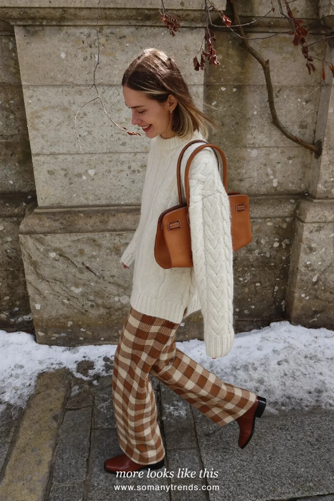 Woman in camel check wide-leg pants, ivory sweater, brown boots and tan bag, outfit 22