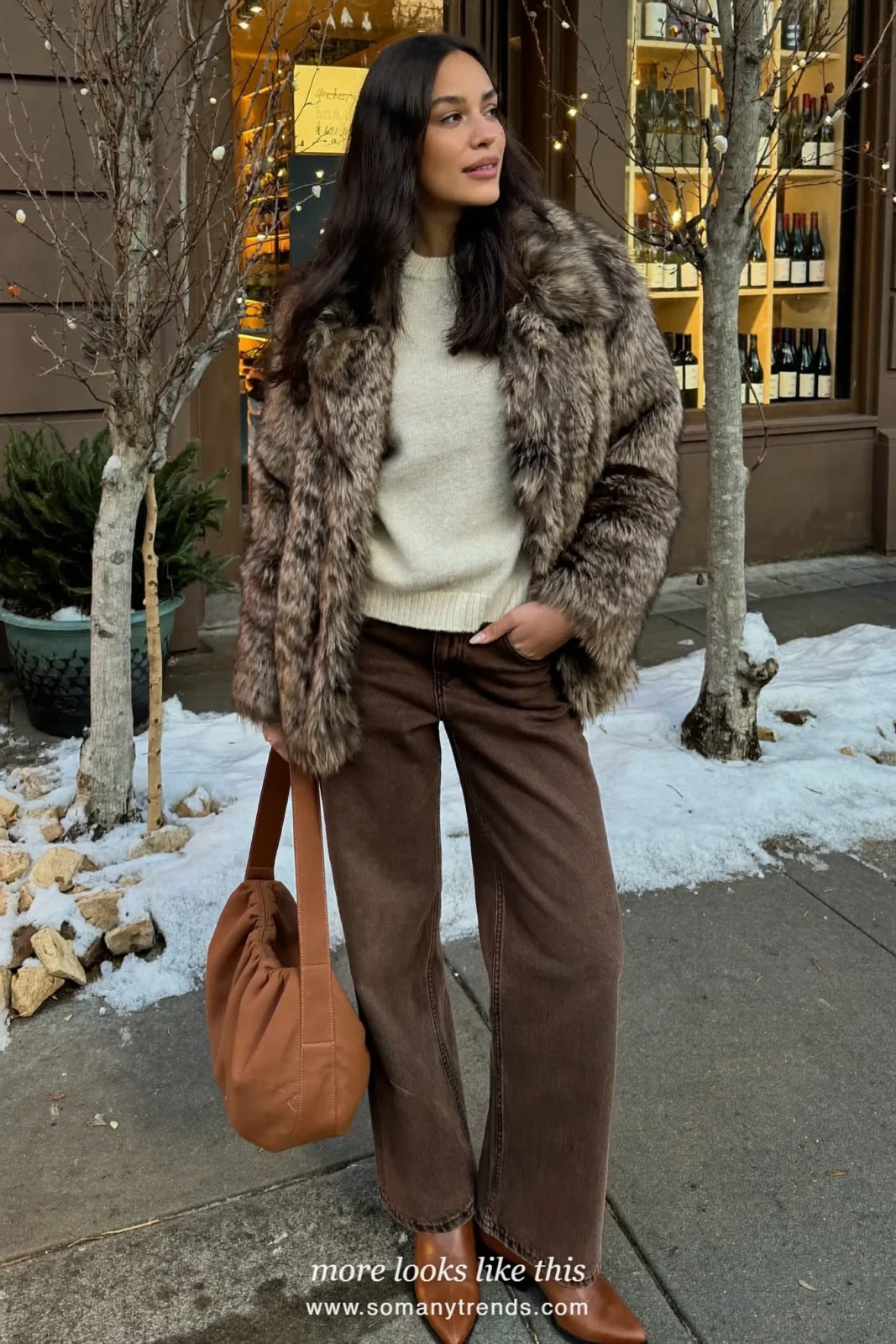 Woman in brown wide-leg jeans, brown faux-fur jacket, cream sweater and brown boots, outfit 30