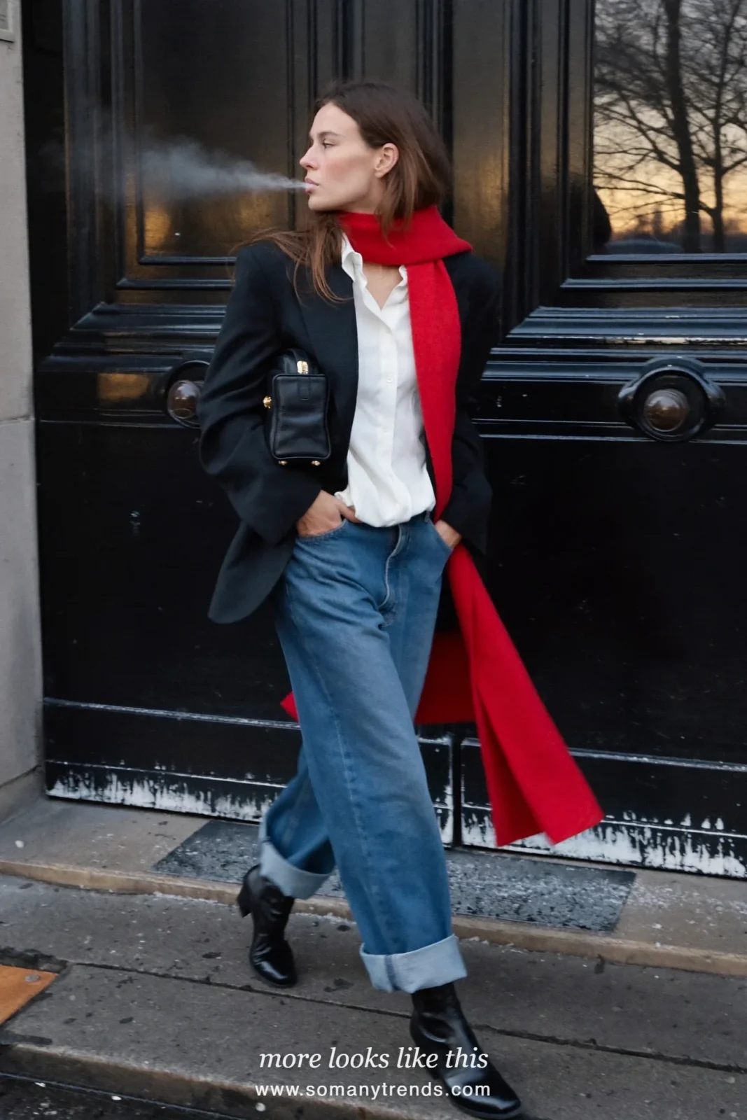 Woman in a black blazer, white shirt, cuffed straight blue jeans, red wool scarf and black boots in Paris, outfit 7