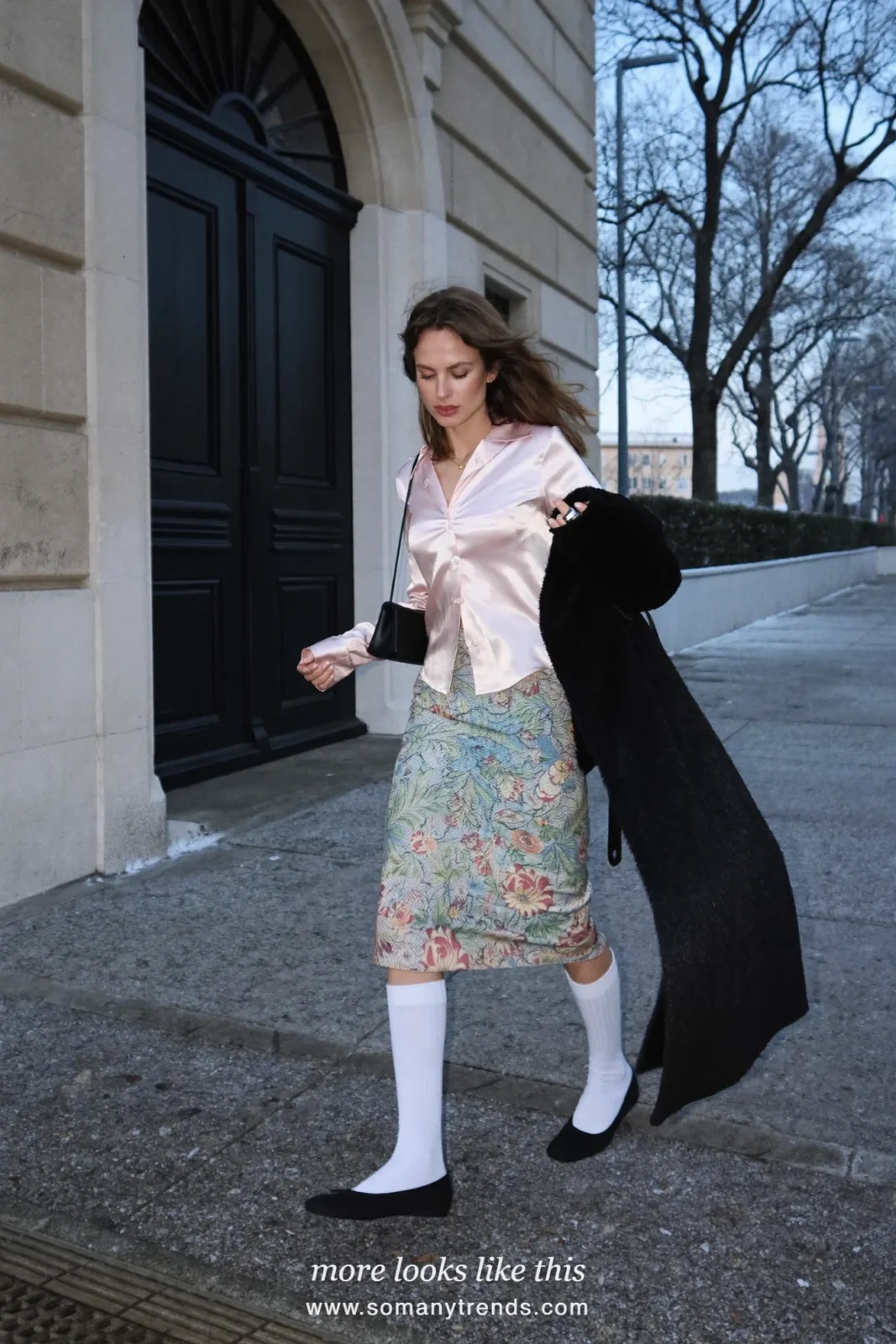 Woman in a pink satin shirt, printed brocade skirt, white knee socks and black flats on a Paris street, outfit 9