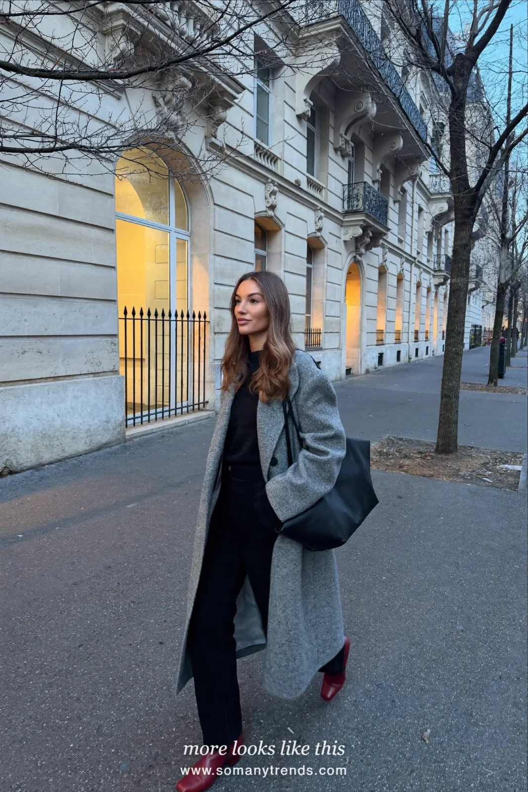 Woman in a long gray wool coat, black knit and pants and red leather ankle boots on a Paris street, outfit 13