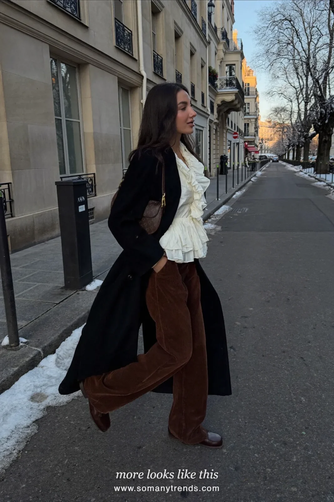 Woman in a white ruffle blouse, brown wide corduroy pants and brown loafers in Paris, outfit 18