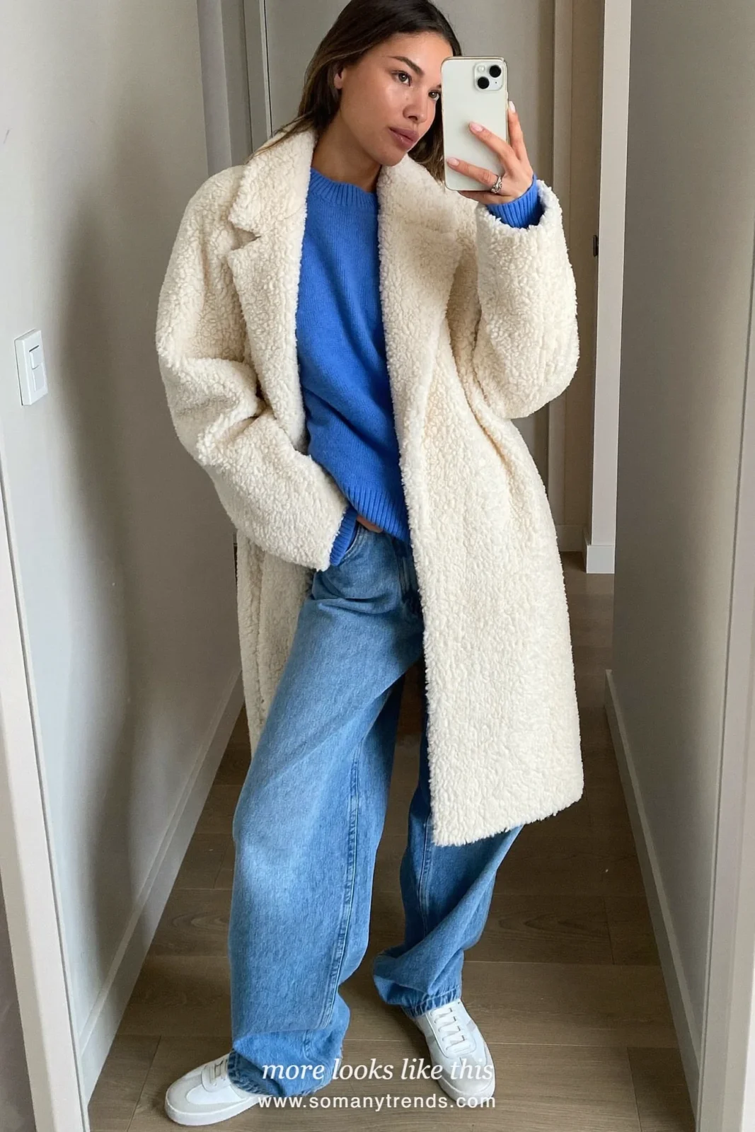 Baby blue sweater, light straight jeans and white sneakers in a mirror selfie, outfit 4