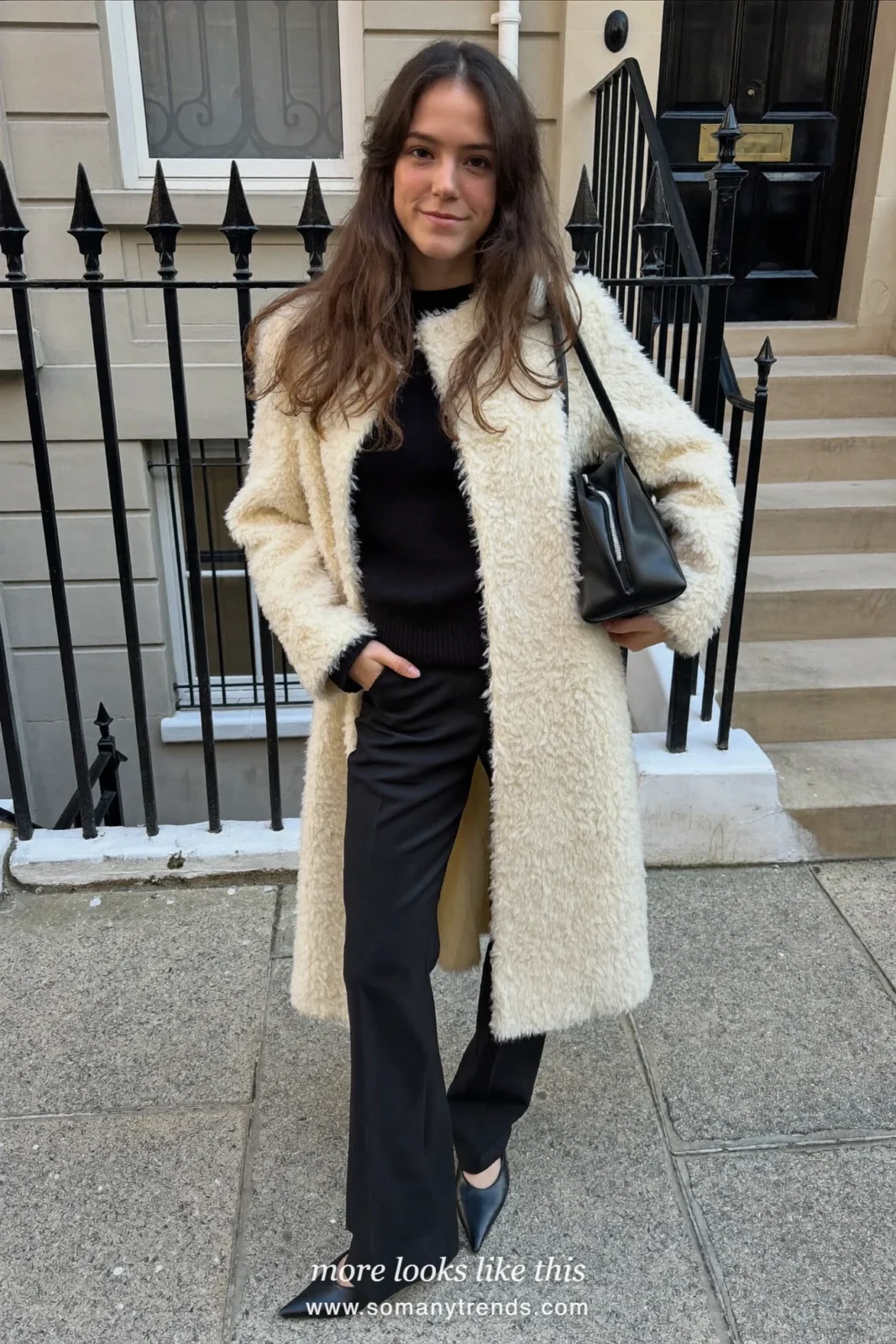 Long cream teddy coat over black knit, black wide-leg pants and black flats, outfit 10