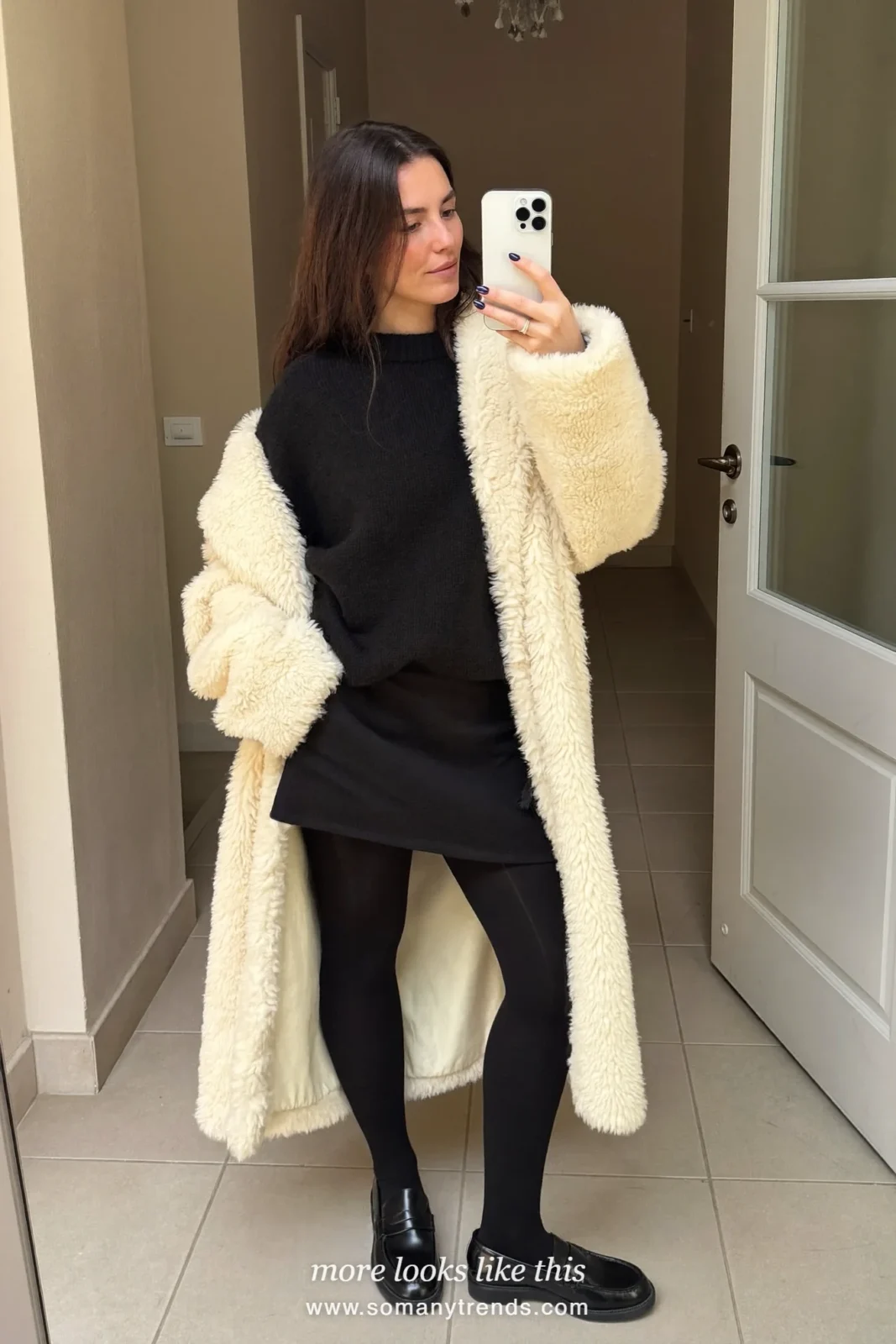 Cream teddy coat over black knit, short black wool skirt, sheer black tights and black loafers, outfit 16
