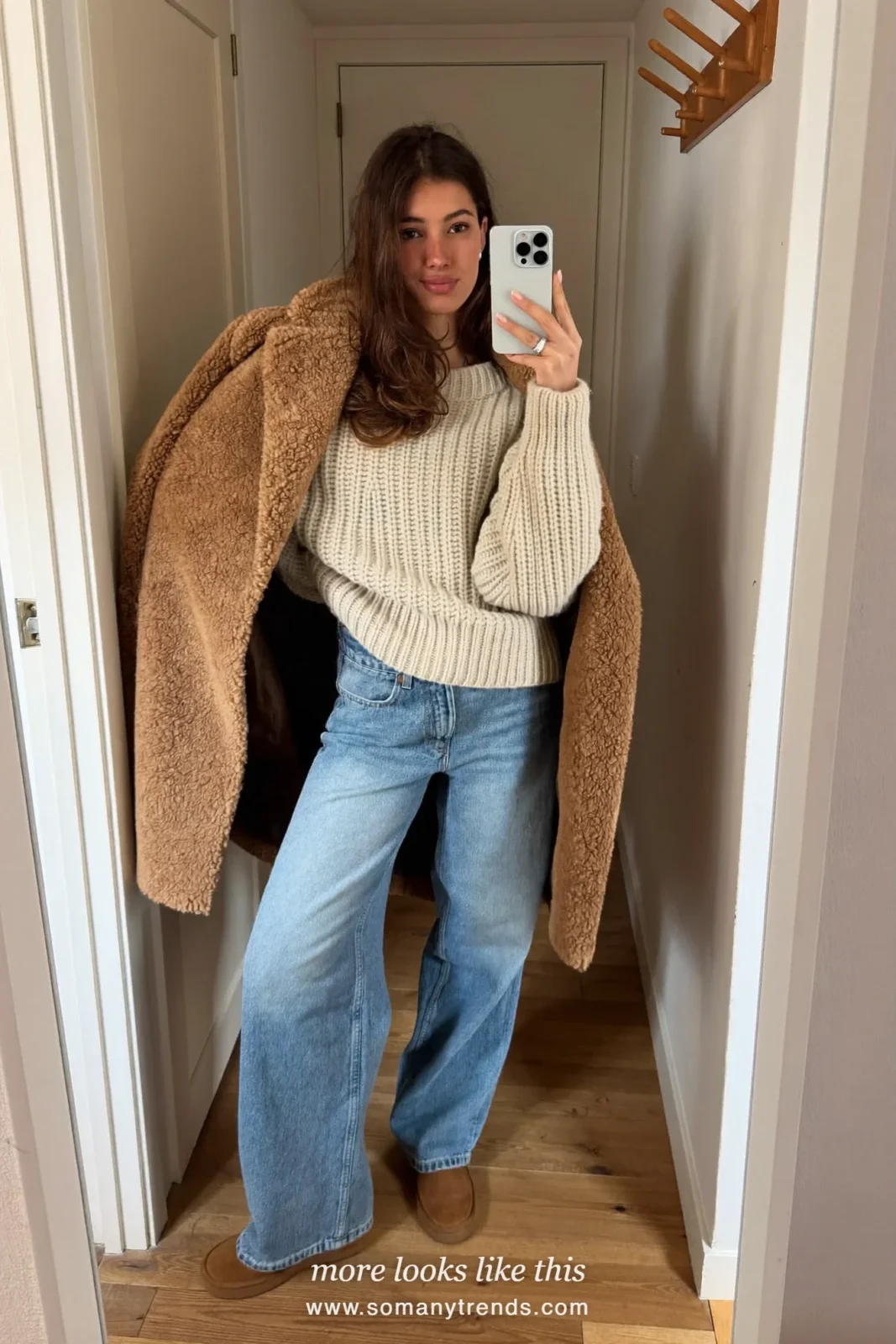 Camel teddy coat over cream knit, baby blue wide-leg jeans and brown suede boots, outfit 20