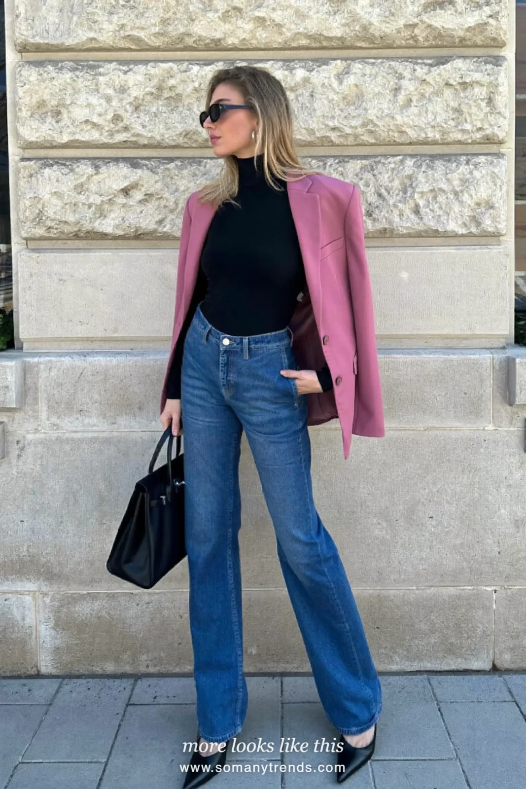 Woman in a rose blazer, black turtleneck, mid-blue flare jeans and black almond-toe pumps outdoors, outfit 18