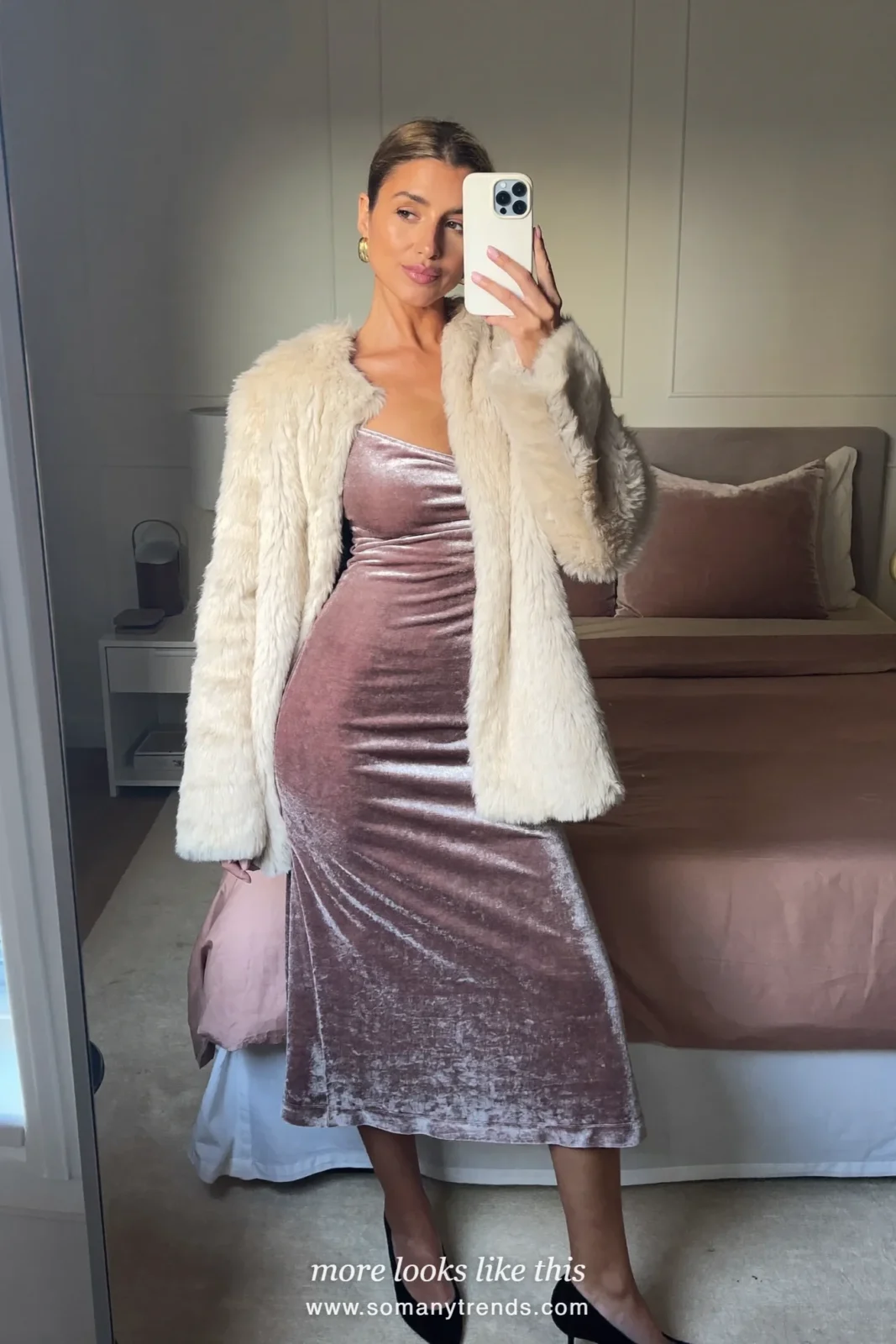 Woman in a mauve velvet slip midi dress under a short cream faux-fur jacket with black sheer tights and pumps, outfit 8