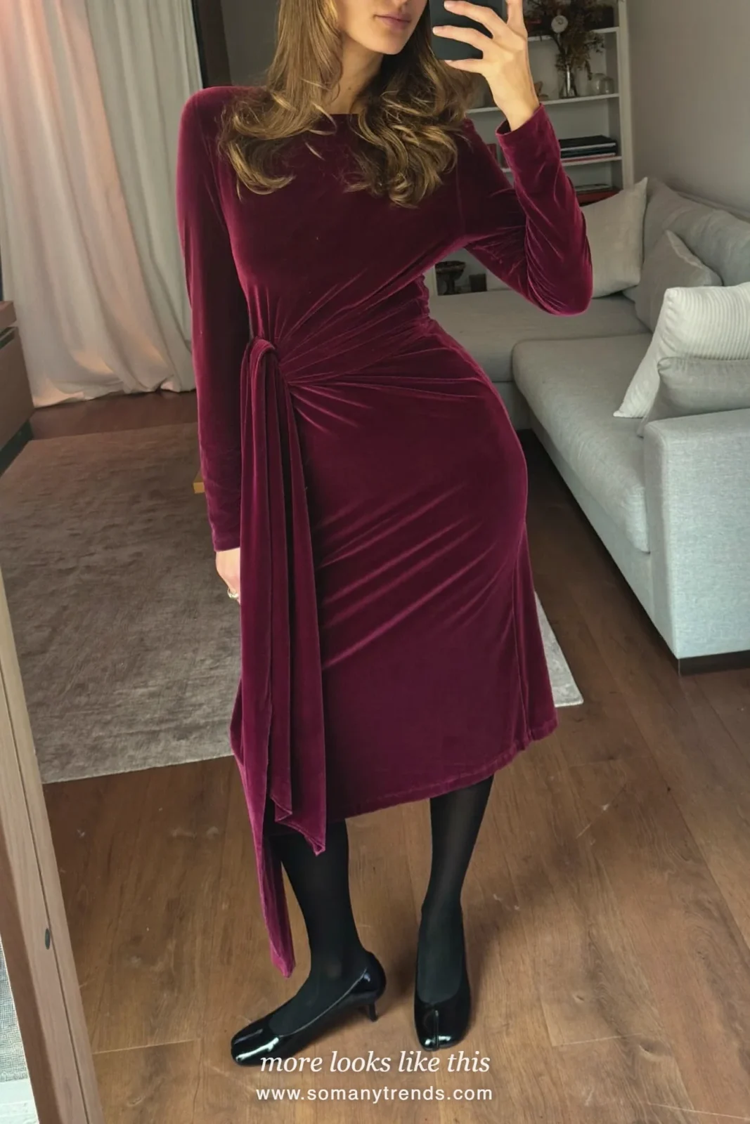 Woman in a burgundy velvet midi dress with a wrap-effect bodice, sheer black tights and black pumps, outfit 12