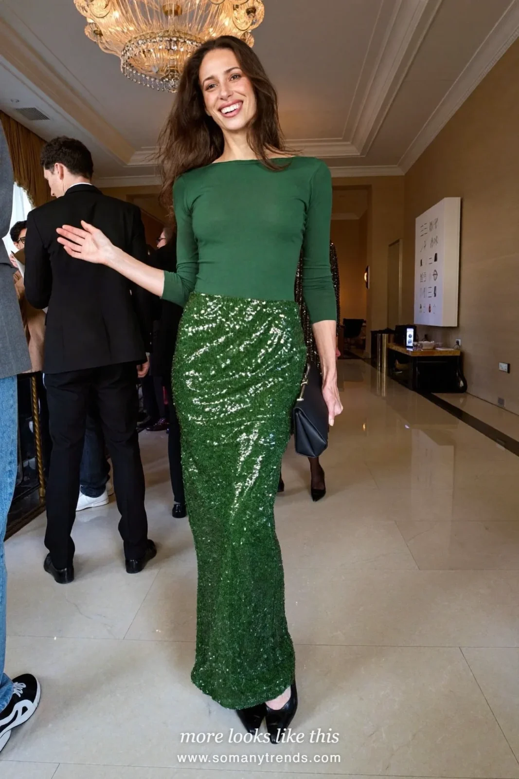 Woman in a forest green sequin long skirt and matching fitted long-sleeve top with black pumps in a hotel ballroom, outfit 23
