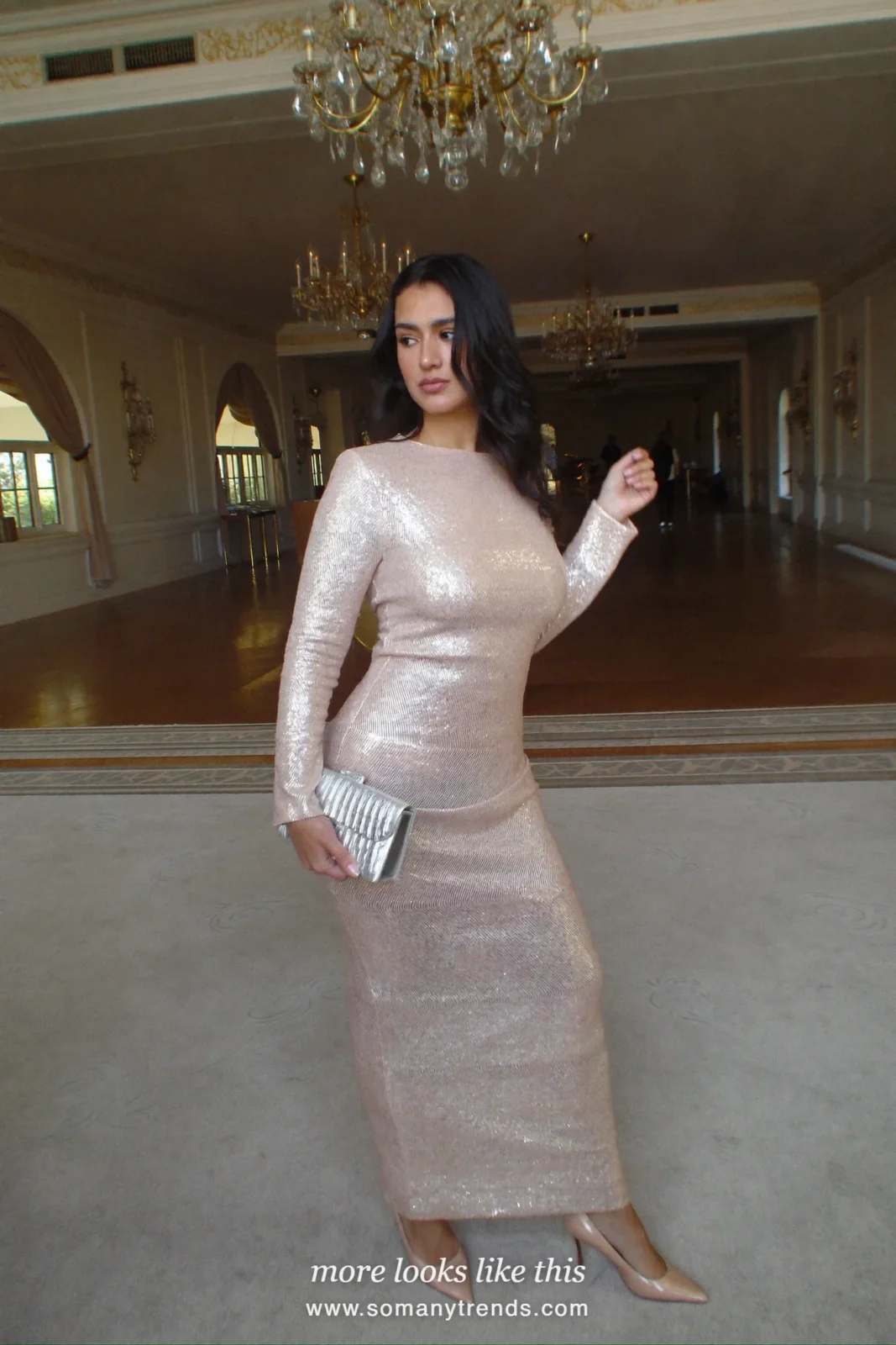 Woman in a pale pink sequin long-sleeve column gown with nude pumps in a hotel ballroom, outfit 26