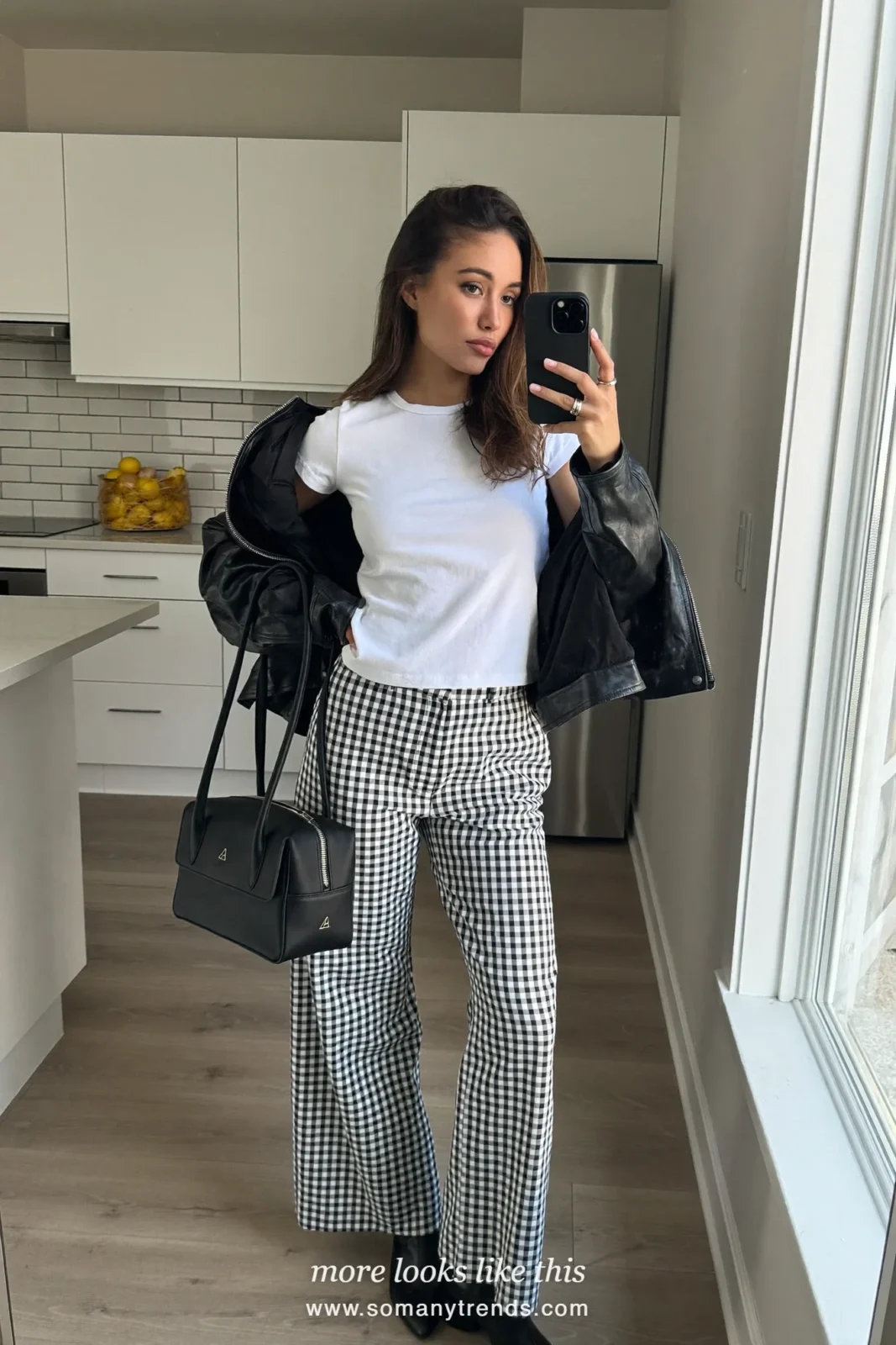 Woman in black and white check wide-leg pants, black leather jacket, white tee and ankle boots, outfit 20