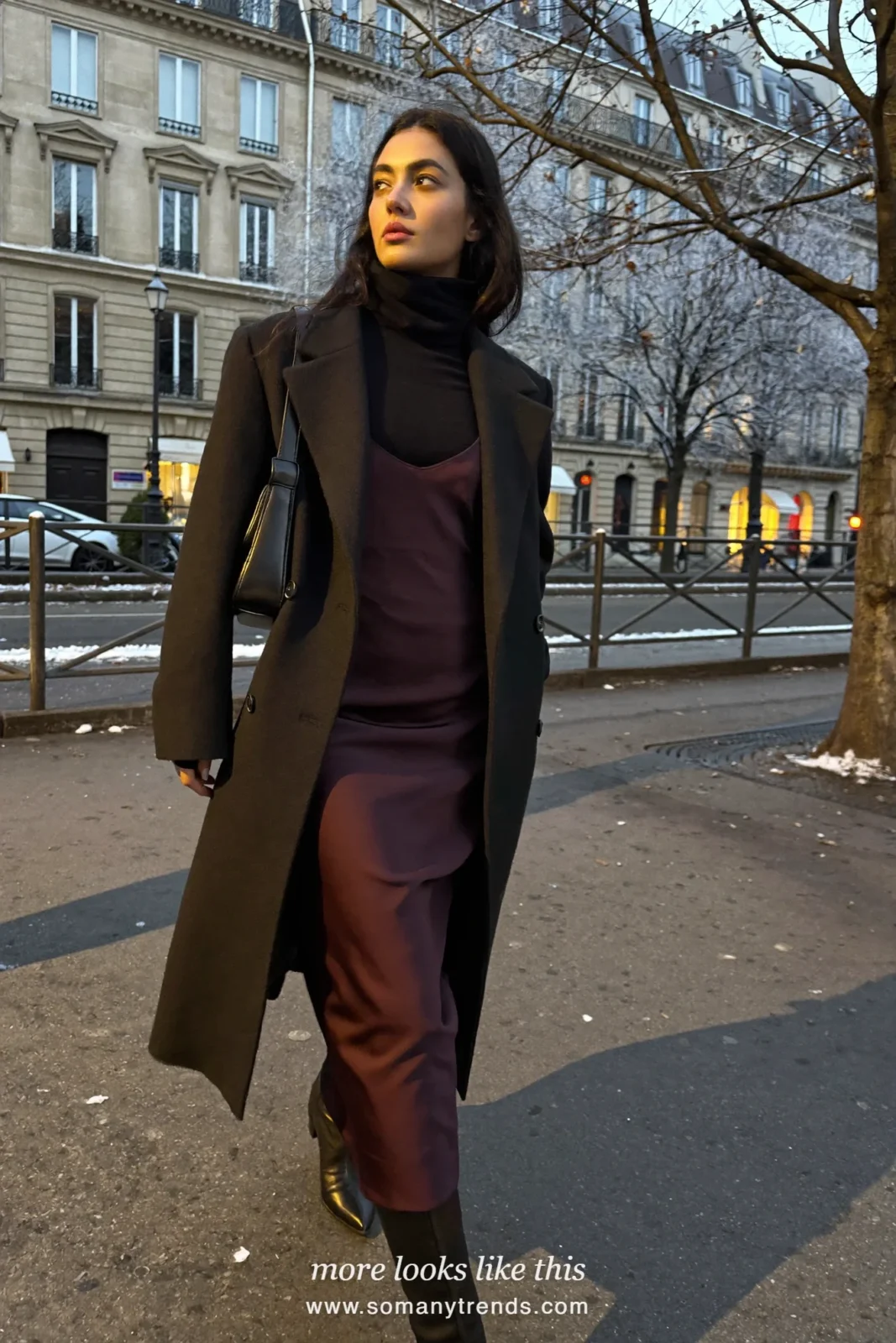 Woman in a plum slip dress over a black turtleneck, long wool coat, tights and ankle boots in Paris, outfit 29