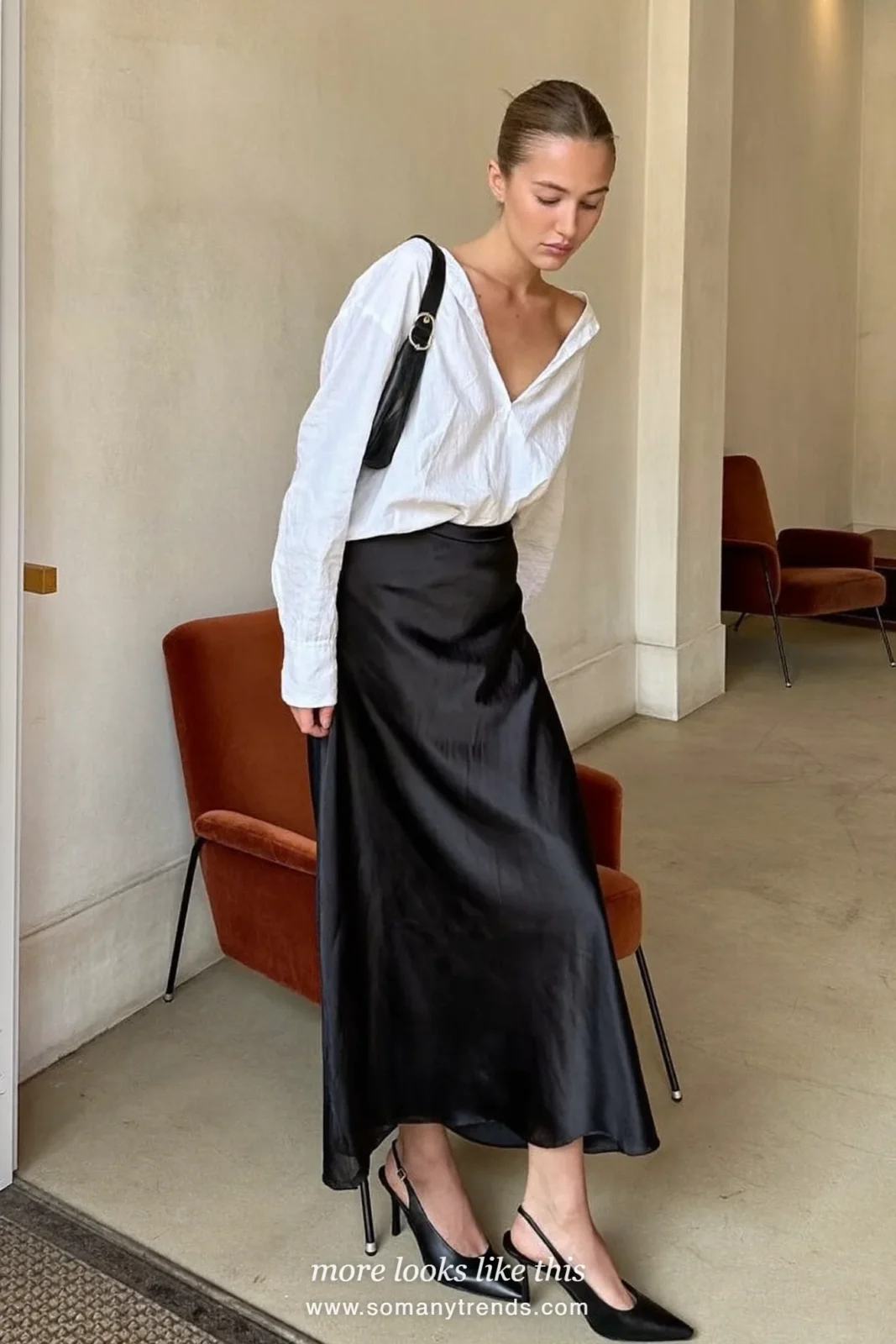 Woman in soft white blouse, black satin long skirt and black slingbacks, outfit 14