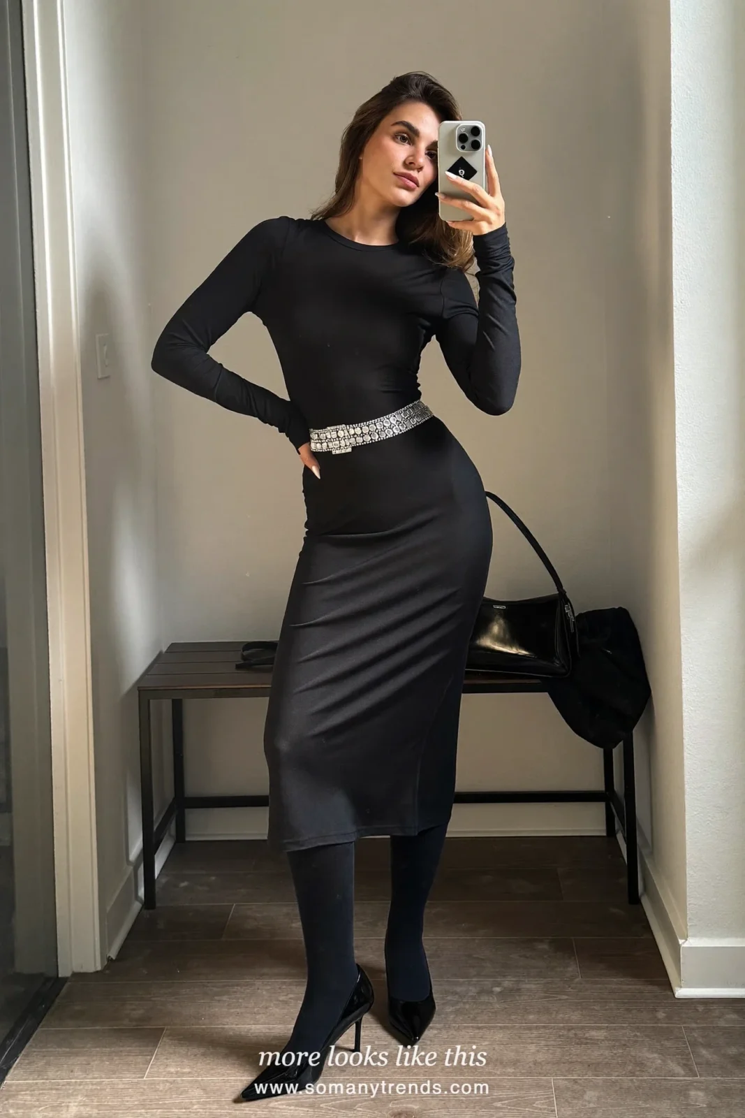 Woman in black long-sleeve midi dress with sparkle belt, sheer black tights and black pumps, outfit 20