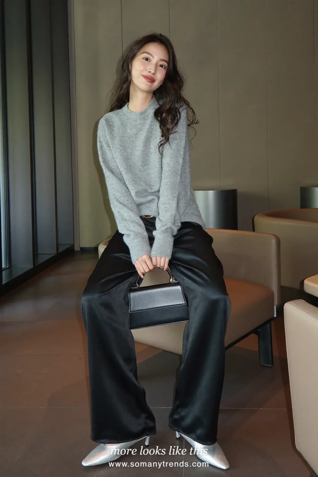 Woman in gray cashmere sweater, black satin wide-leg pants and silver flats, outfit 22