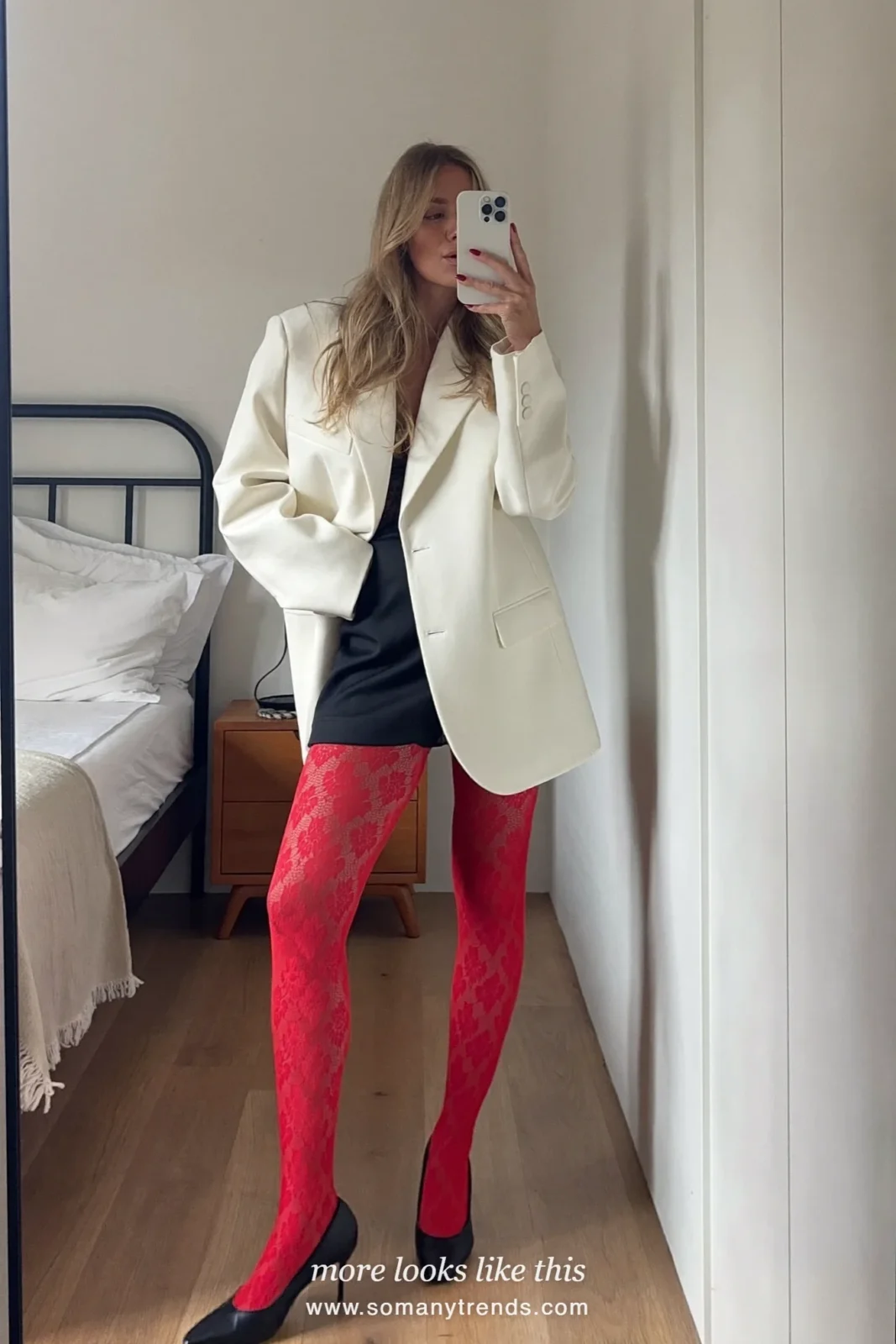 Woman in an oversized white blazer, black mini skirt, red lace tights and black pumps, outfit 6