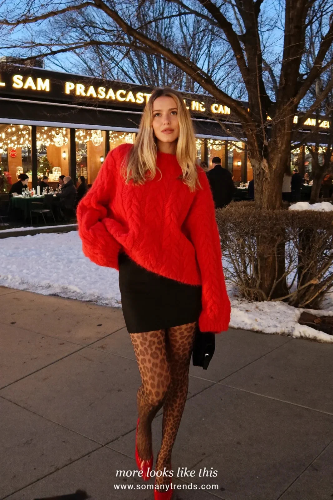 Woman in a red knit sweater, black mini skirt, leopard print tights and red pumps, outfit 8