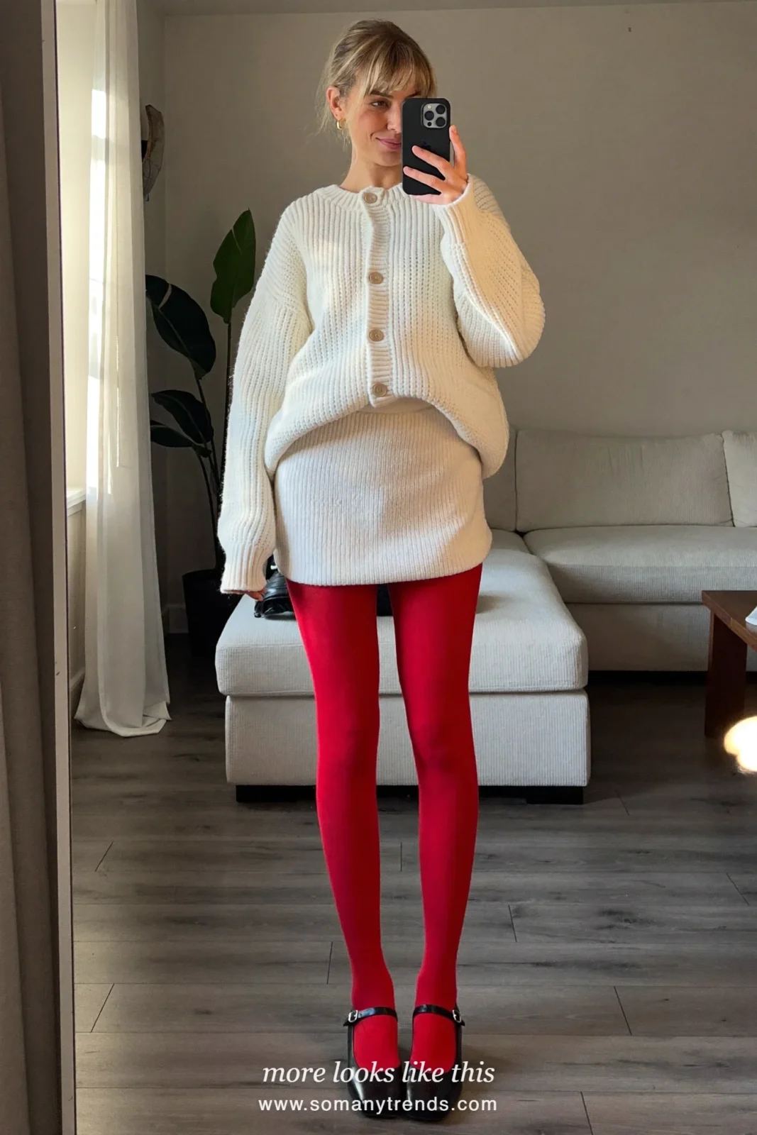 Woman in a cream knit cardigan and matching mini skirt, opaque red tights and black Mary Janes, outfit 21