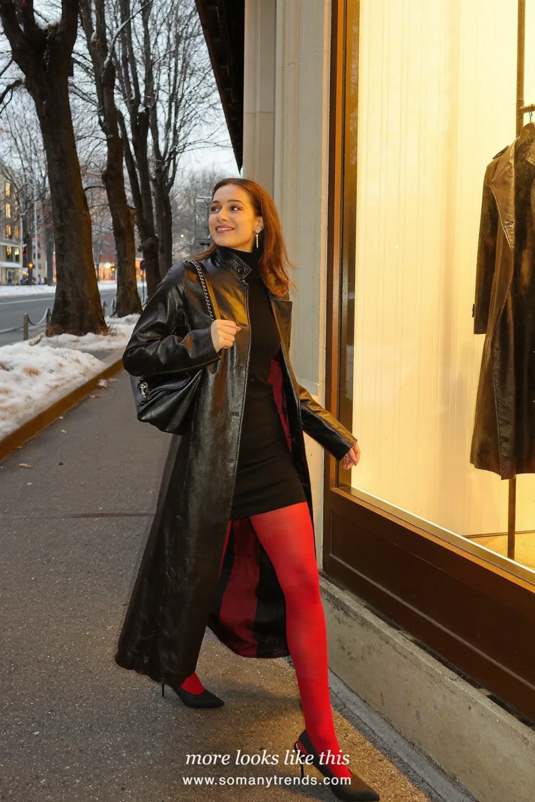 Woman in a long black trench coat, black dress, sheer red tights and black heels, outfit 22