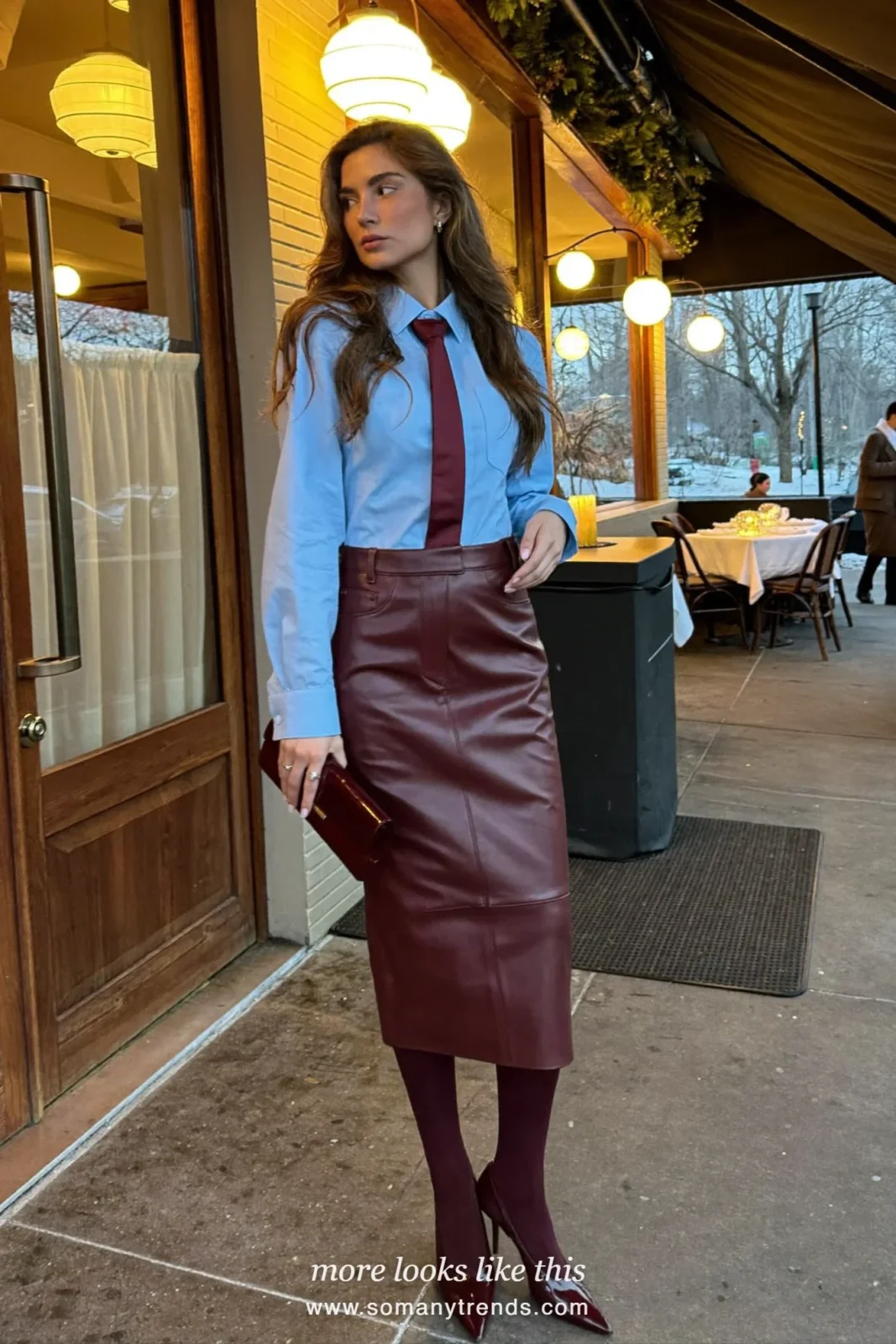 Woman in a baby blue shirt with a burgundy tie, a burgundy leather pencil skirt, burgundy opaque tights and burgundy pointed pumps, outfit 1