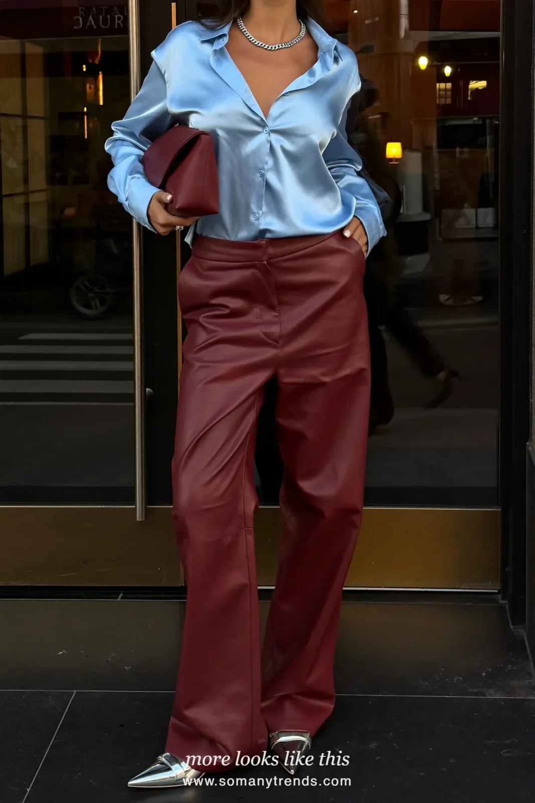 Woman in burgundy faux leather wide-leg pants, a baby blue satin camisole top and silver pointed flats, outfit 17
