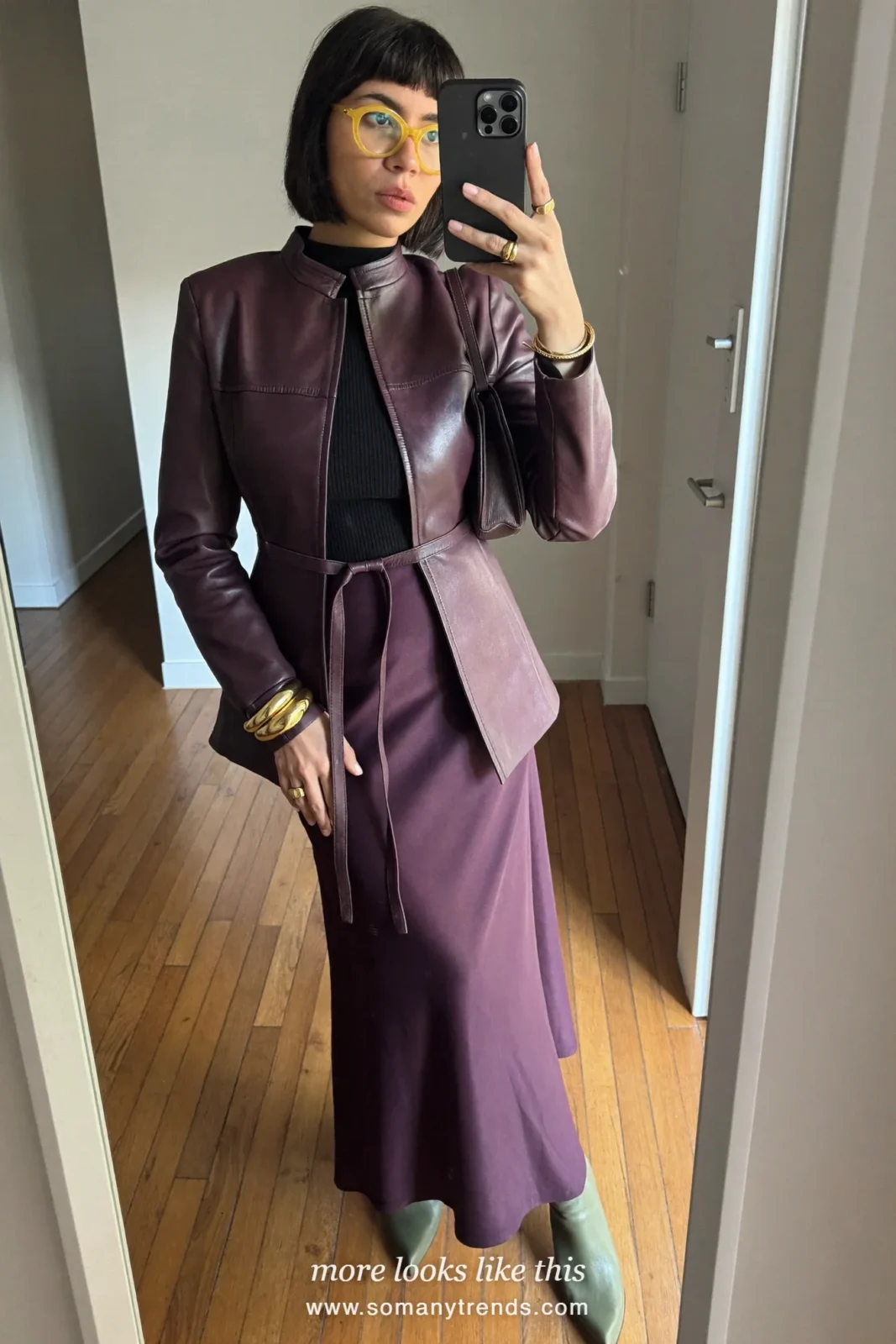 Plum belted leather jacket, plum satin slip maxi skirt, black fitted top and sage green boots, outfit 12