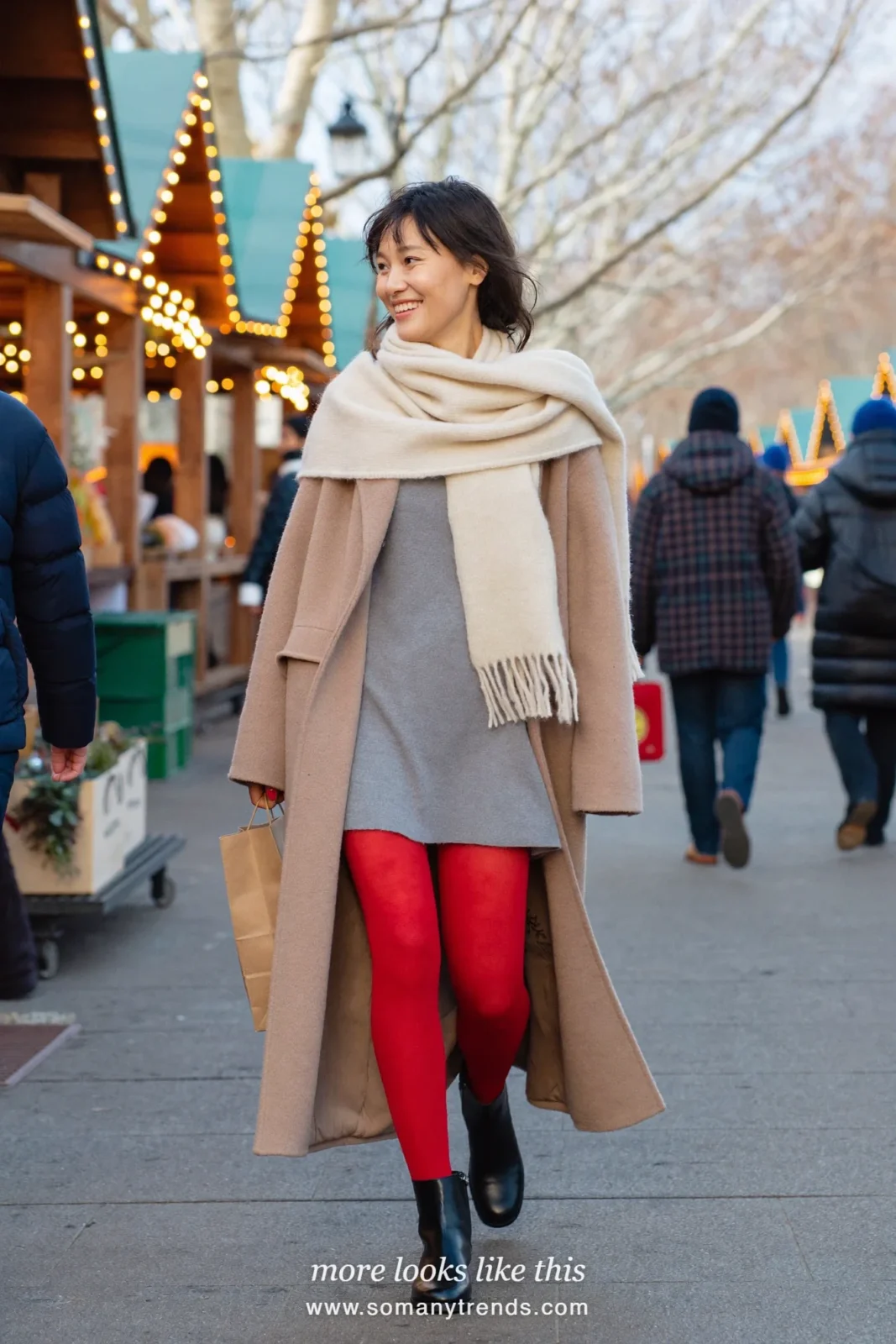 Woman in a beige wool coat, gray knit mini dress, sheer red tights and black ankle boots, outfit 25