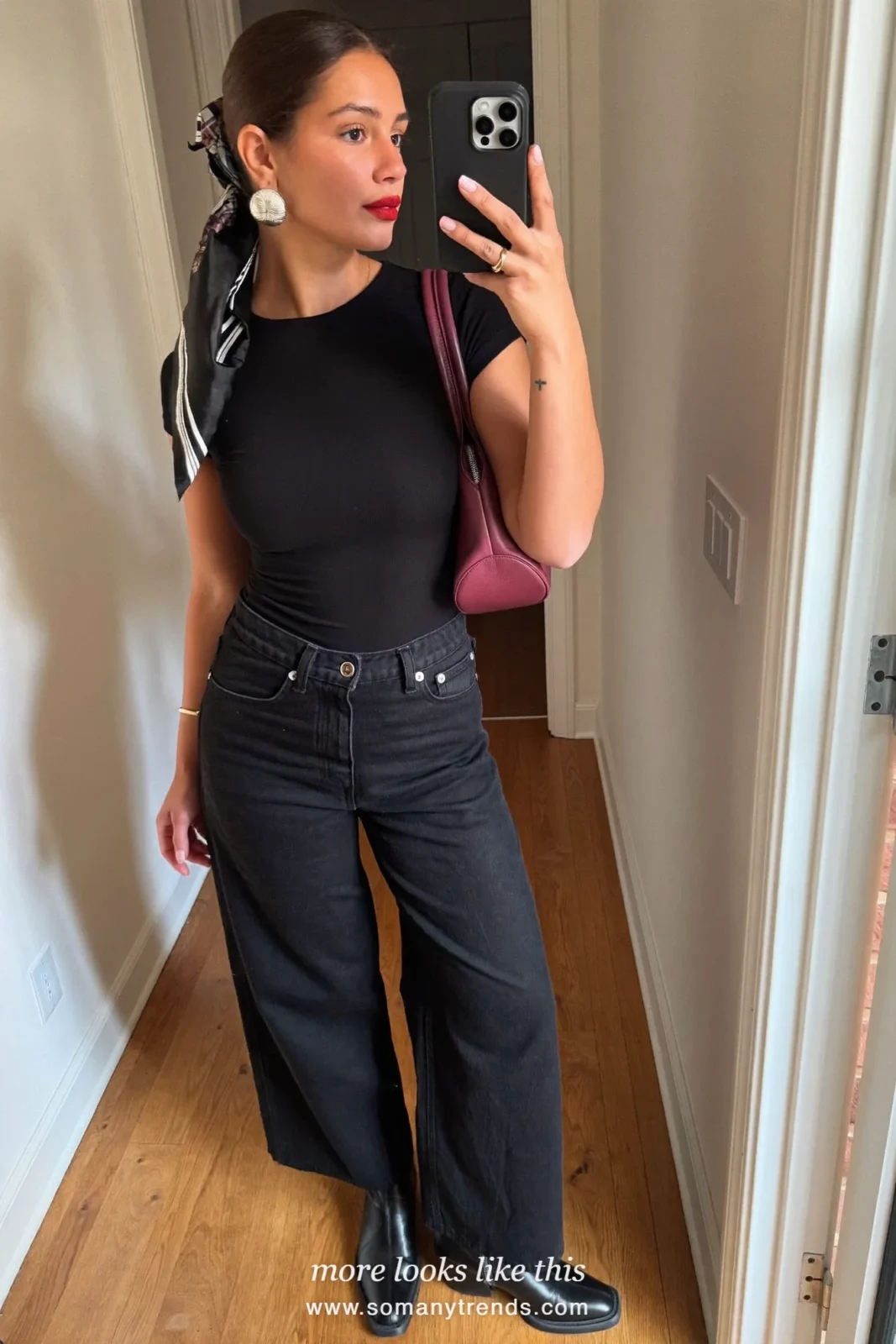 Black coat, black jeans, black boots and plum leather shoulder bag, outfit 27