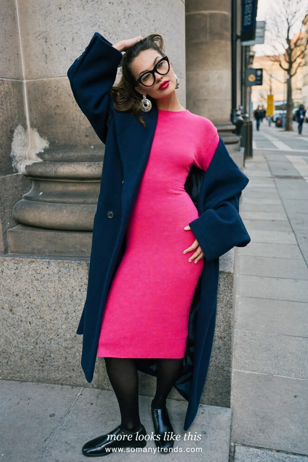 Woman in a long navy blue coat over a hot pink knit dress, black tights and low boots, outfit 14