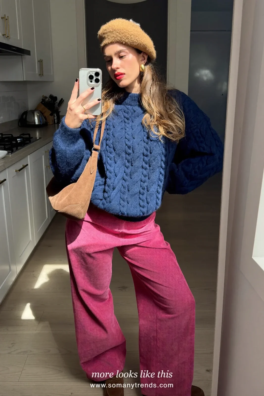 Woman in a navy blue knit sweater, pink corduroy pants and brown suede loafers, outfit 15