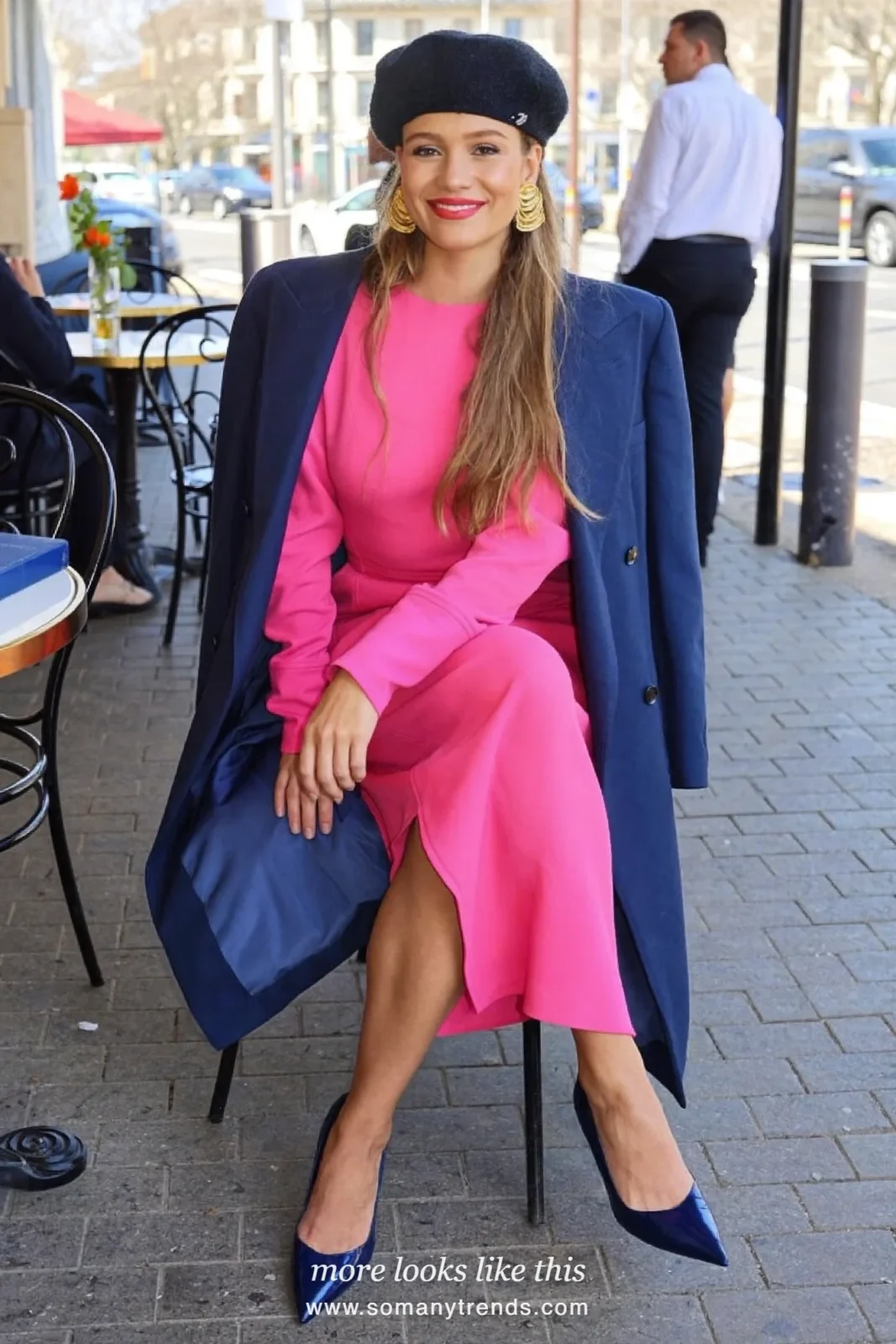 Woman in a hot pink midi dress with a long navy blue blazer and navy pumps, outfit 23